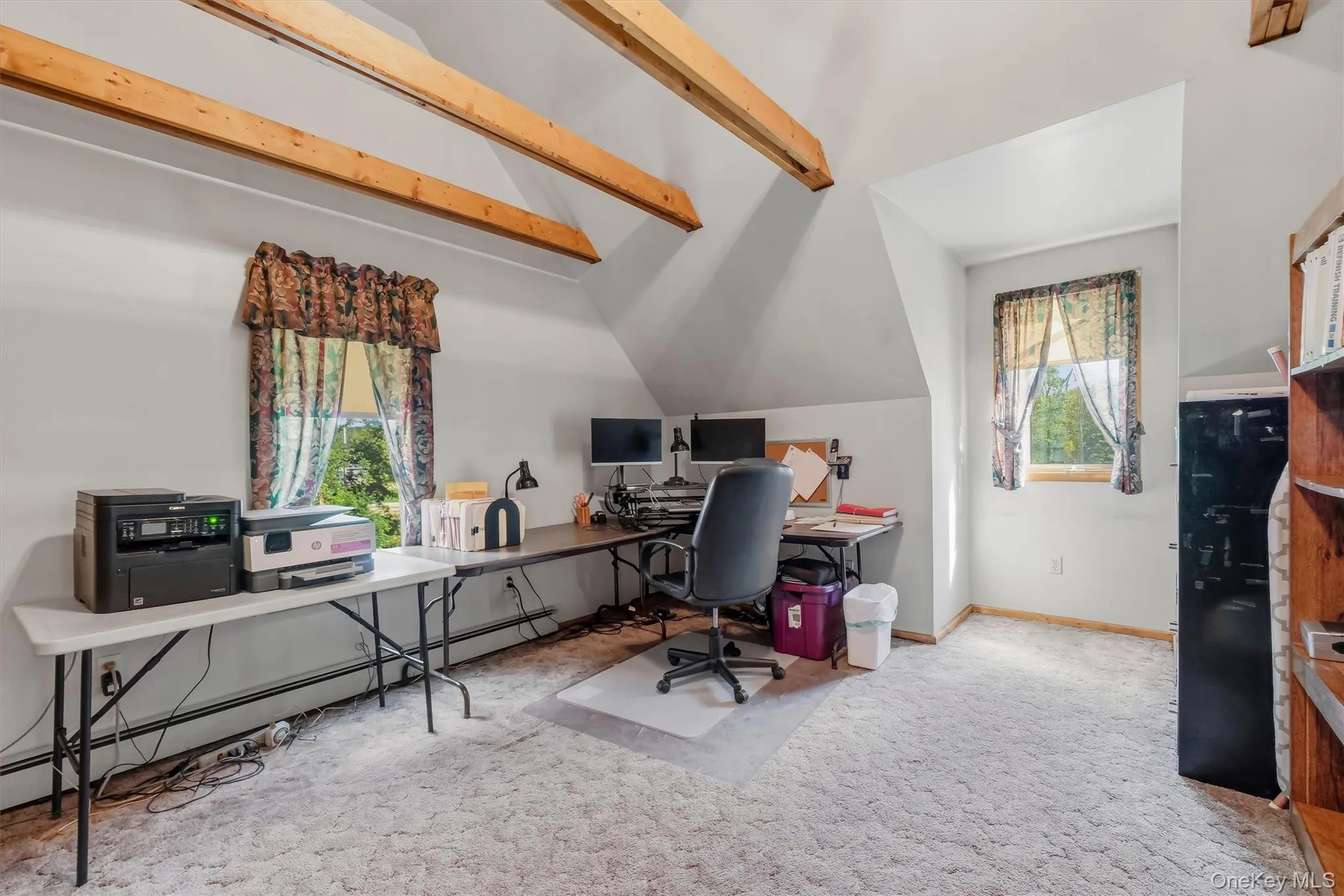 Upstairs bedroom used as an office. Vaulted ceilings are complemented by exposed beams and the sunlight that pours in from the dormer window. Upstairs bedroom used as an office. Vaulted ceilings are complemented by exposed beams and the sunlight that pours in from the dormer window.