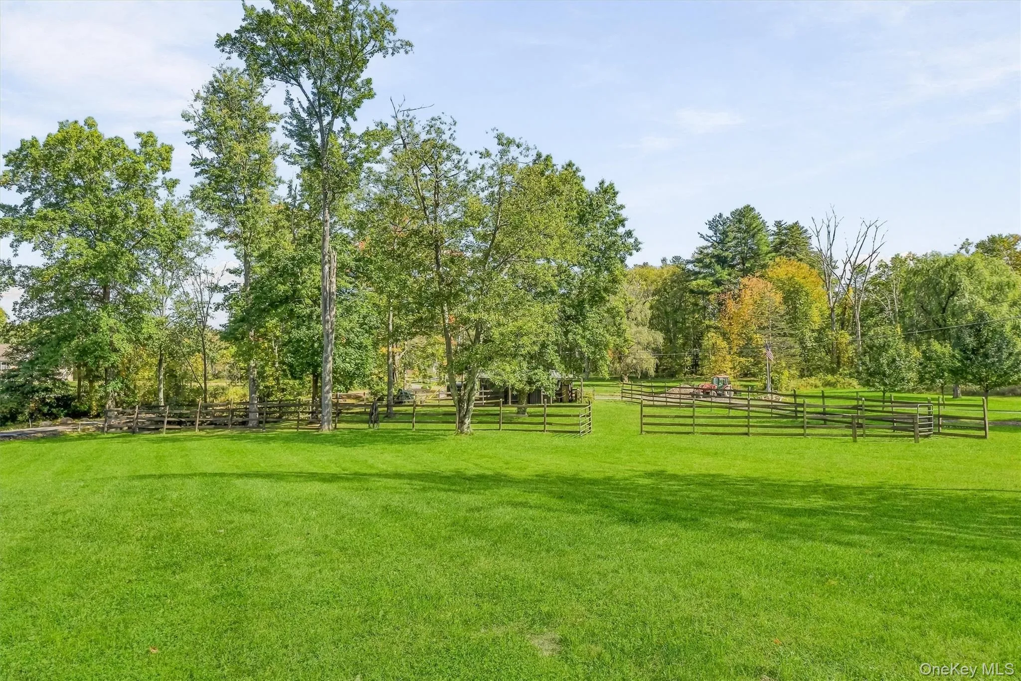 The view from the front yard towards the barn. How special to have your horses out your front door, and be able to ride right to the Trail. The view from the front yard towards the barn. How special to have your horses out your front door, and be able to ride right to the Trail.