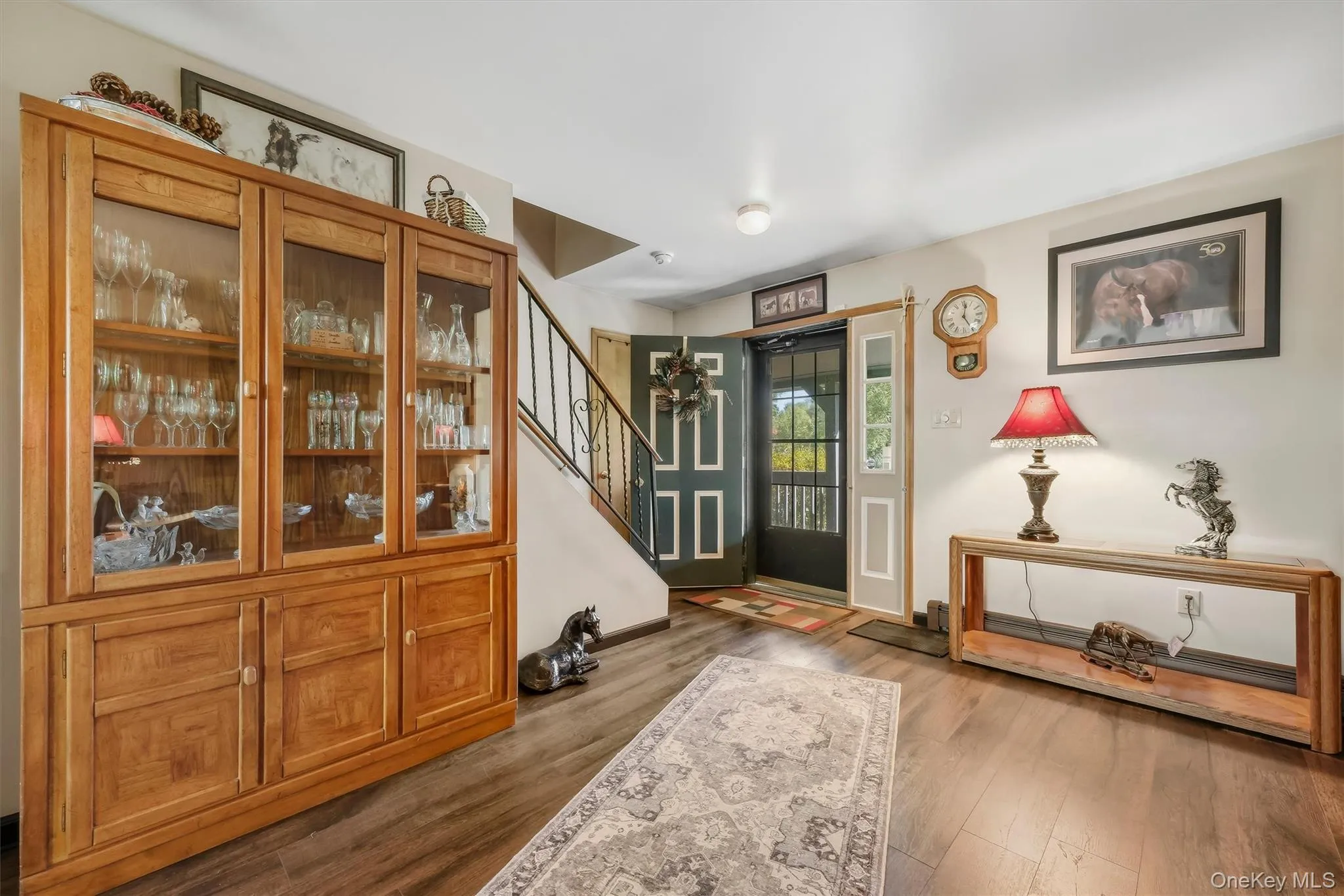 Front entry into the home brings you into the spacious living room. Walnut LVP lends a farmhouse feel. Front entry into the home brings you into the spacious living room. Walnut LVP lends a farmhouse feel.