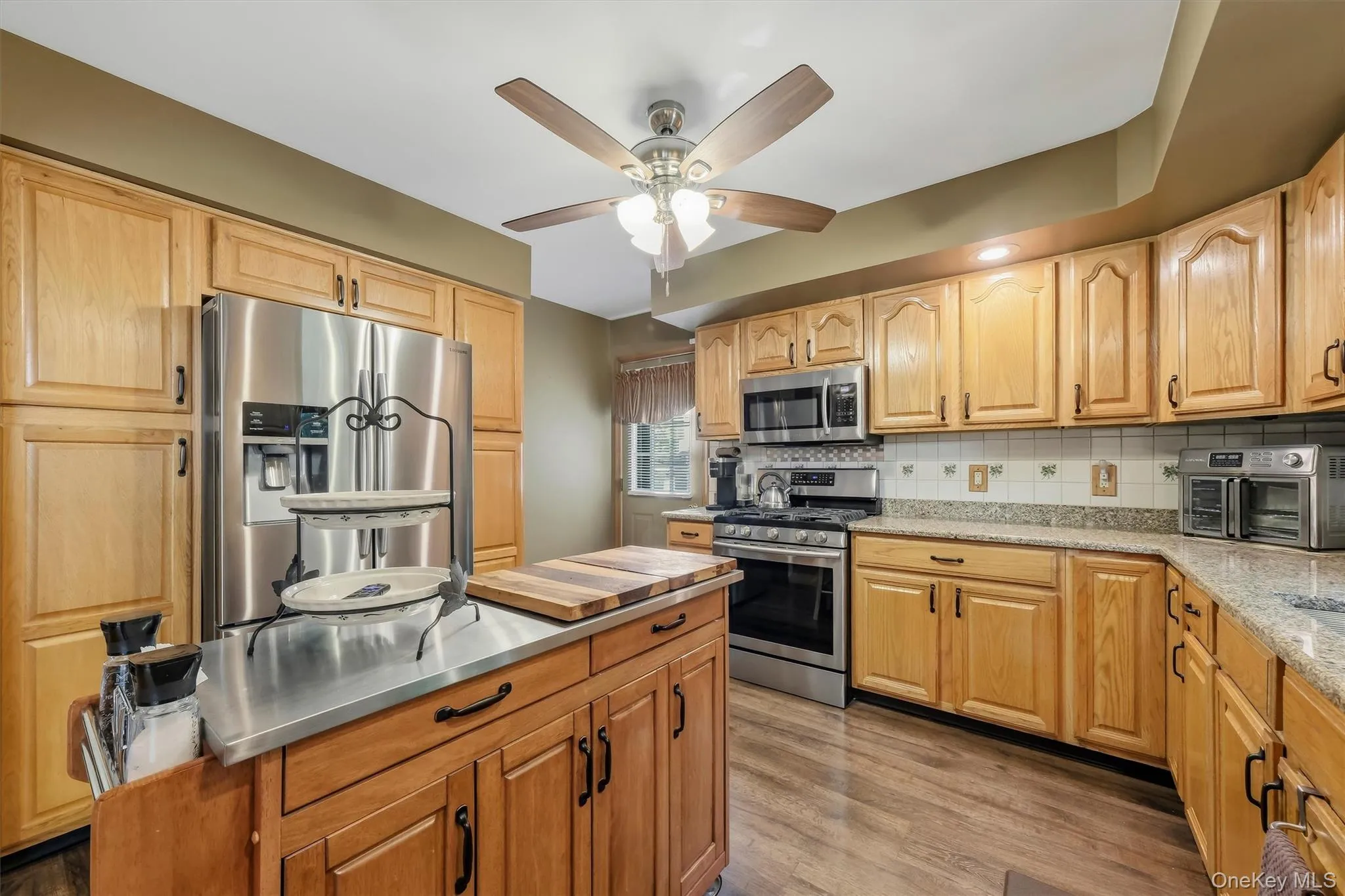 Plenty of quality cabinets, a recessed fridge, enough counter space to prepare a feast, and a side door to the back deck make the kitchen an easy place to turn out a Thanksgiving dinner! Plenty of quality cabinets, a recessed fridge, enough counter space to prepare a feast, and a side door to the back deck make the kitchen an easy place to turn out a Thanksgiving dinner!