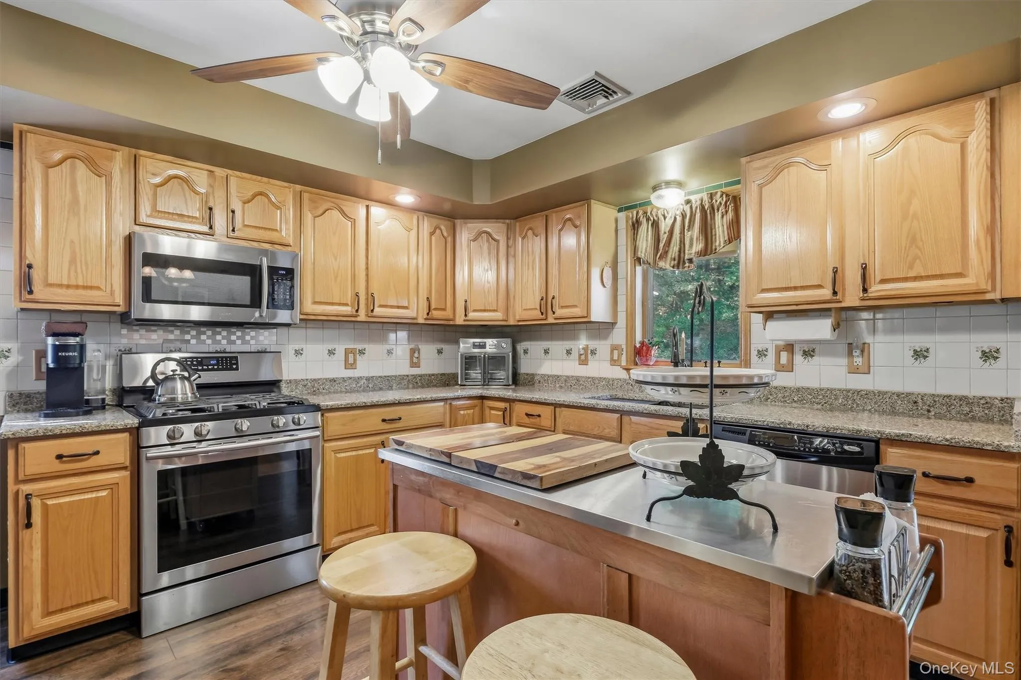 The kitchen was updated with granite counters, LVP floors and a deep farmhouse sink. The kitchen was updated with granite counters, LVP floors and a deep farmhouse sink.