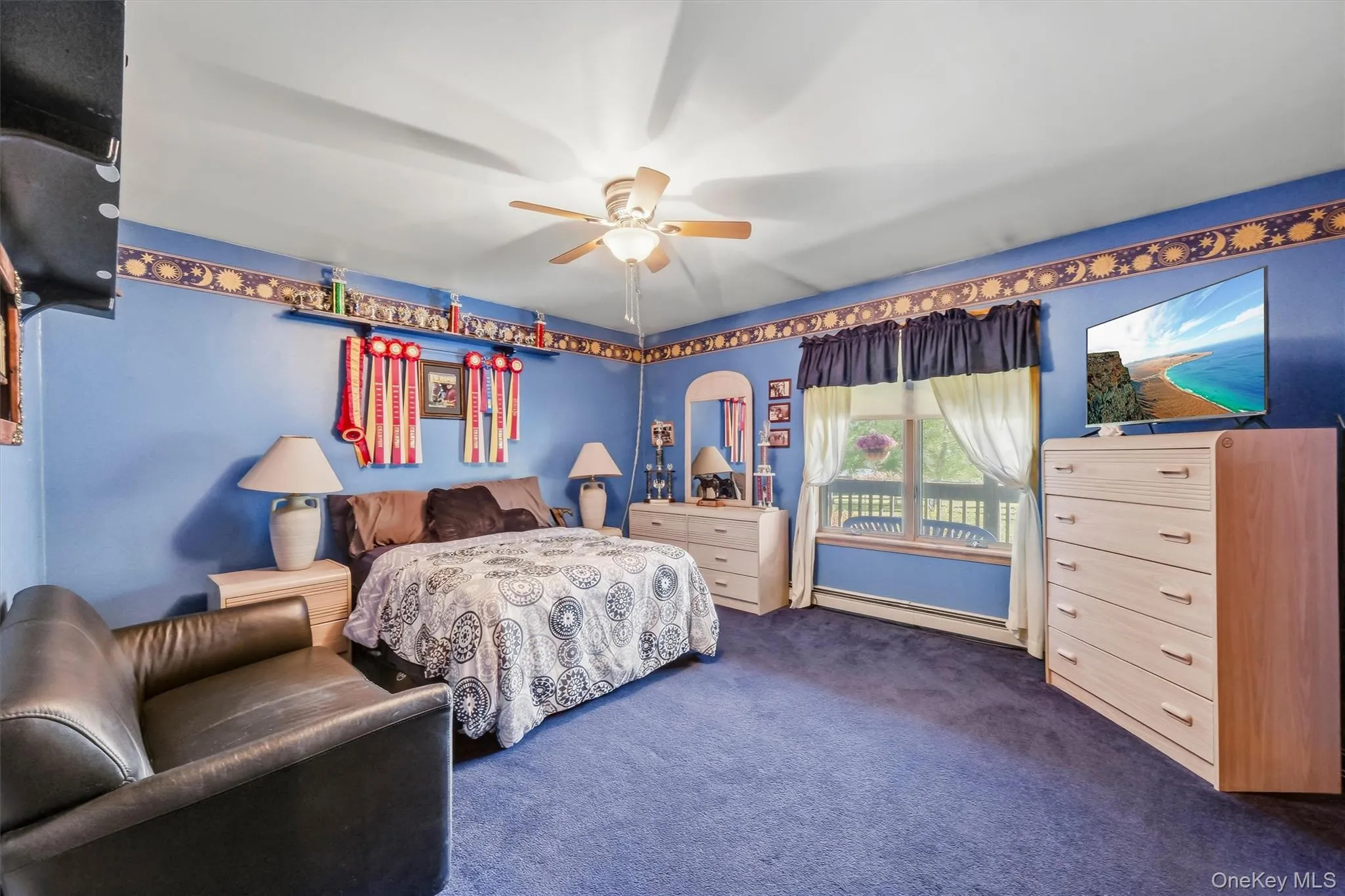 First floor bedroom features a double window, center ceiling fan and generous closet space. First floor bedroom features a double window, center ceiling fan and generous closet space.