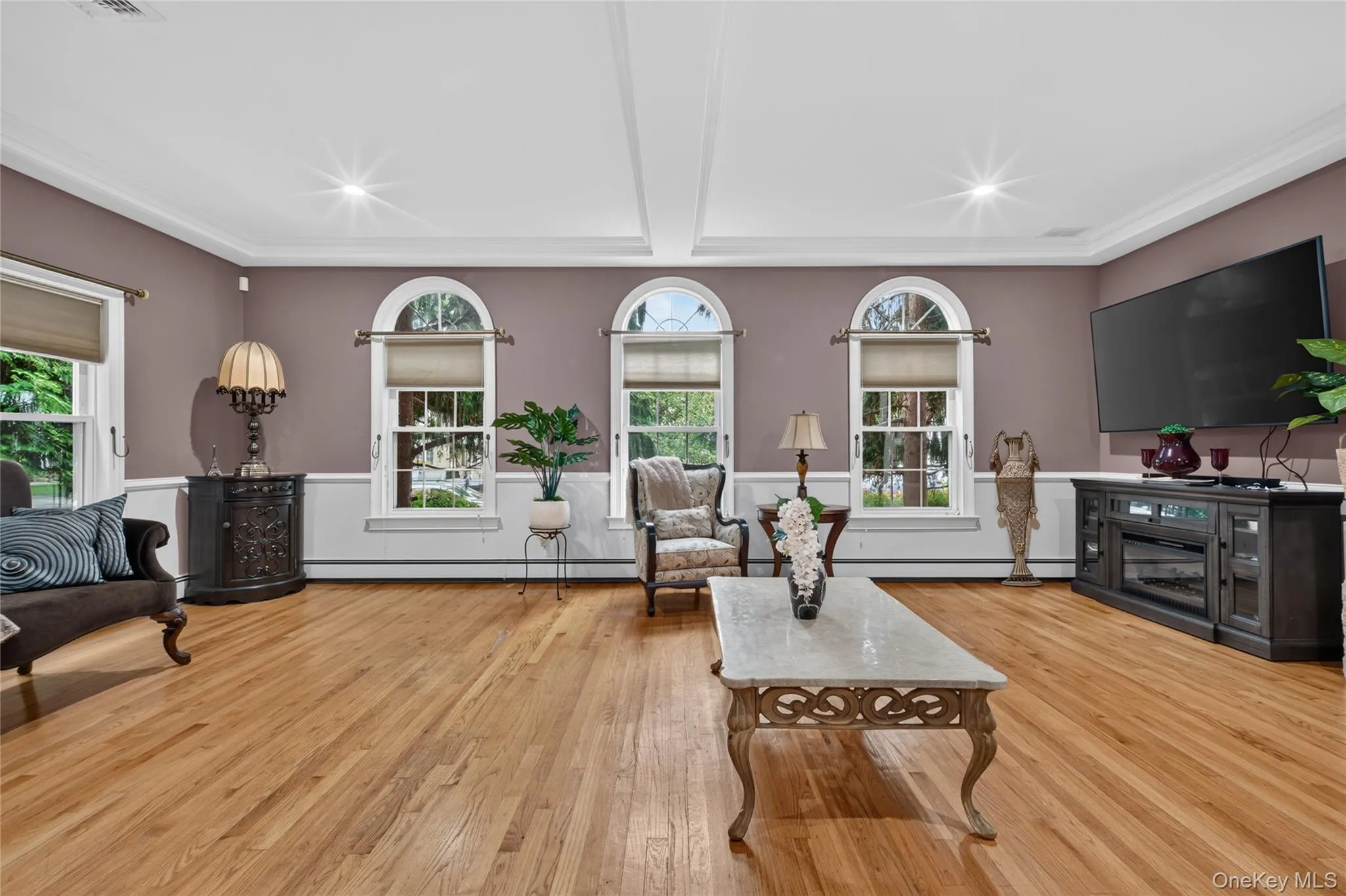 Hardwood flooring, arched windows, crown molding, tray ceiling, recessed lighting Hardwood flooring, arched windows, crown molding, tray ceiling, recessed lighting