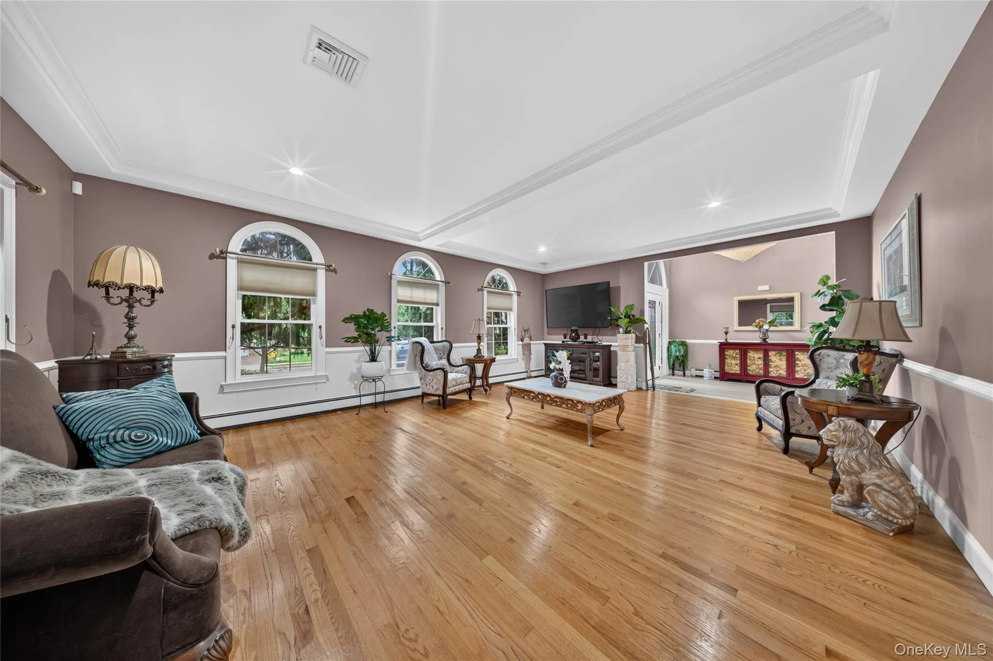 Hardwood flooring, arched windows, crown molding, chair rail detailing, recessed lighting Hardwood flooring, arched windows, crown molding, chair rail detailing, recessed lighting