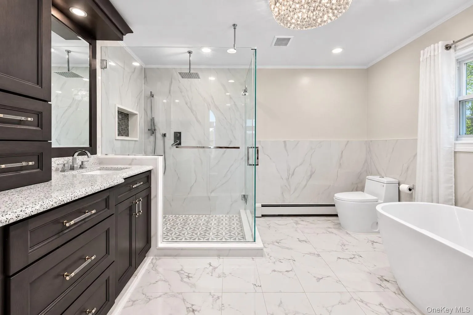 Dark wood-finish vanity with a light speckled countertop Dark wood-finish vanity with a light speckled countertop