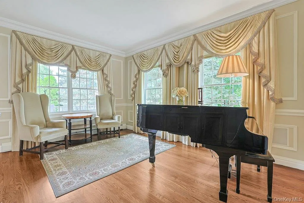 Living Room W/Enlaged Crown and Picture Fram Mouldings, Beautiful Hardwood Flooring, Built-in Speakers Living Room W/Enlaged Crown and Picture Fram Mouldings, Beautiful Hardwood Flooring, Built-in Speakers