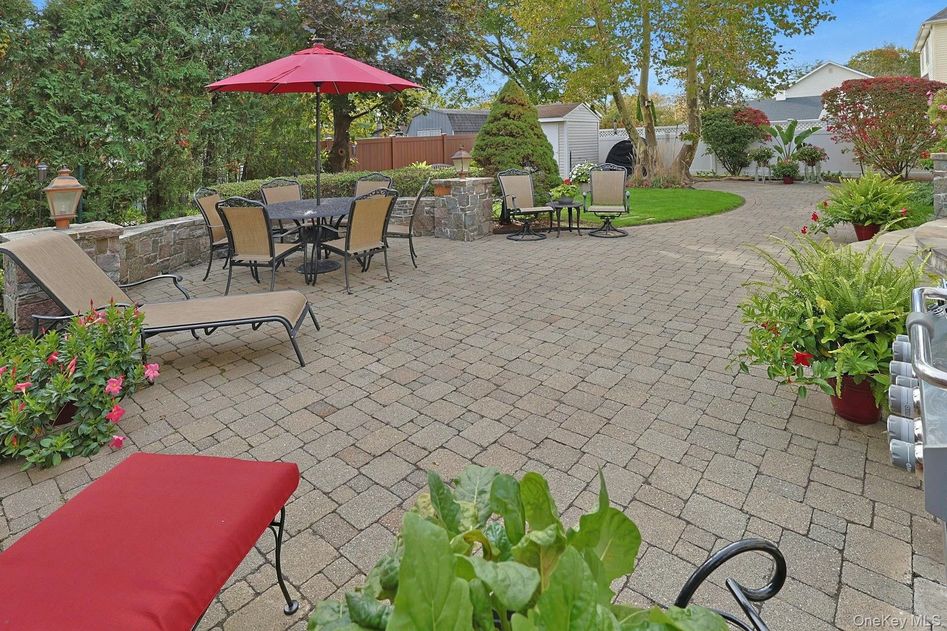 Paver Patio With Granite Stone Sitting Wall and Coach Lanterns Paver Patio With Granite Stone Sitting Wall and Coach Lanterns