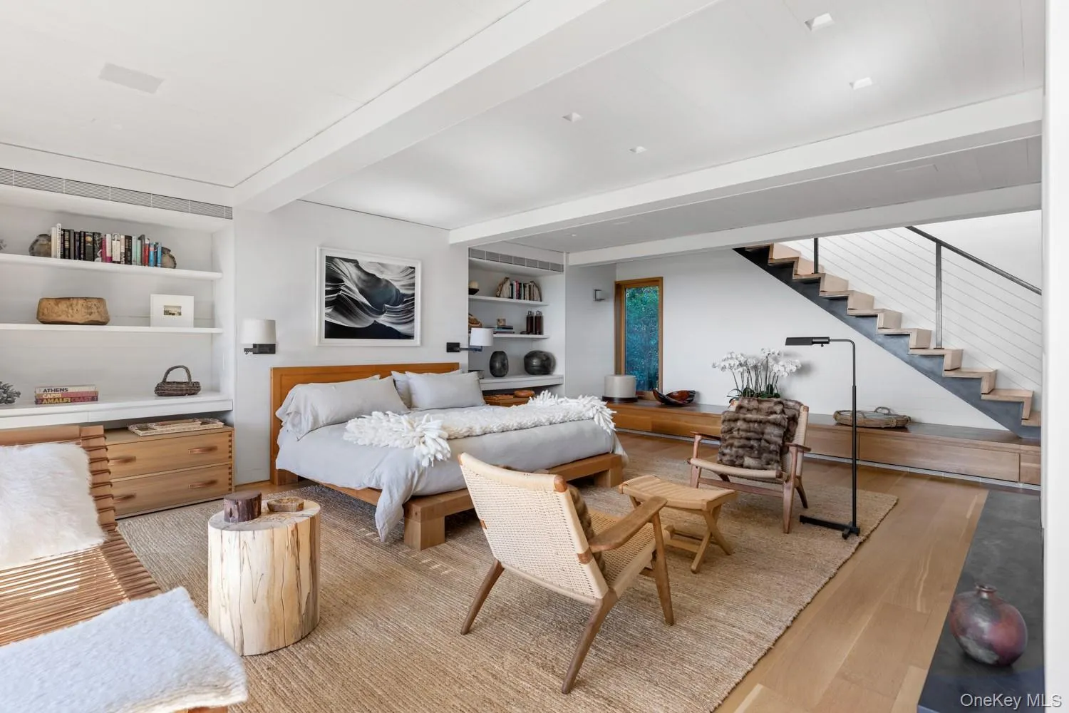 With hardwood floors, custom built-ins, gas fireplace and floating stairs to main floor With hardwood floors, custom built-ins, gas fireplace and floating stairs to main floor