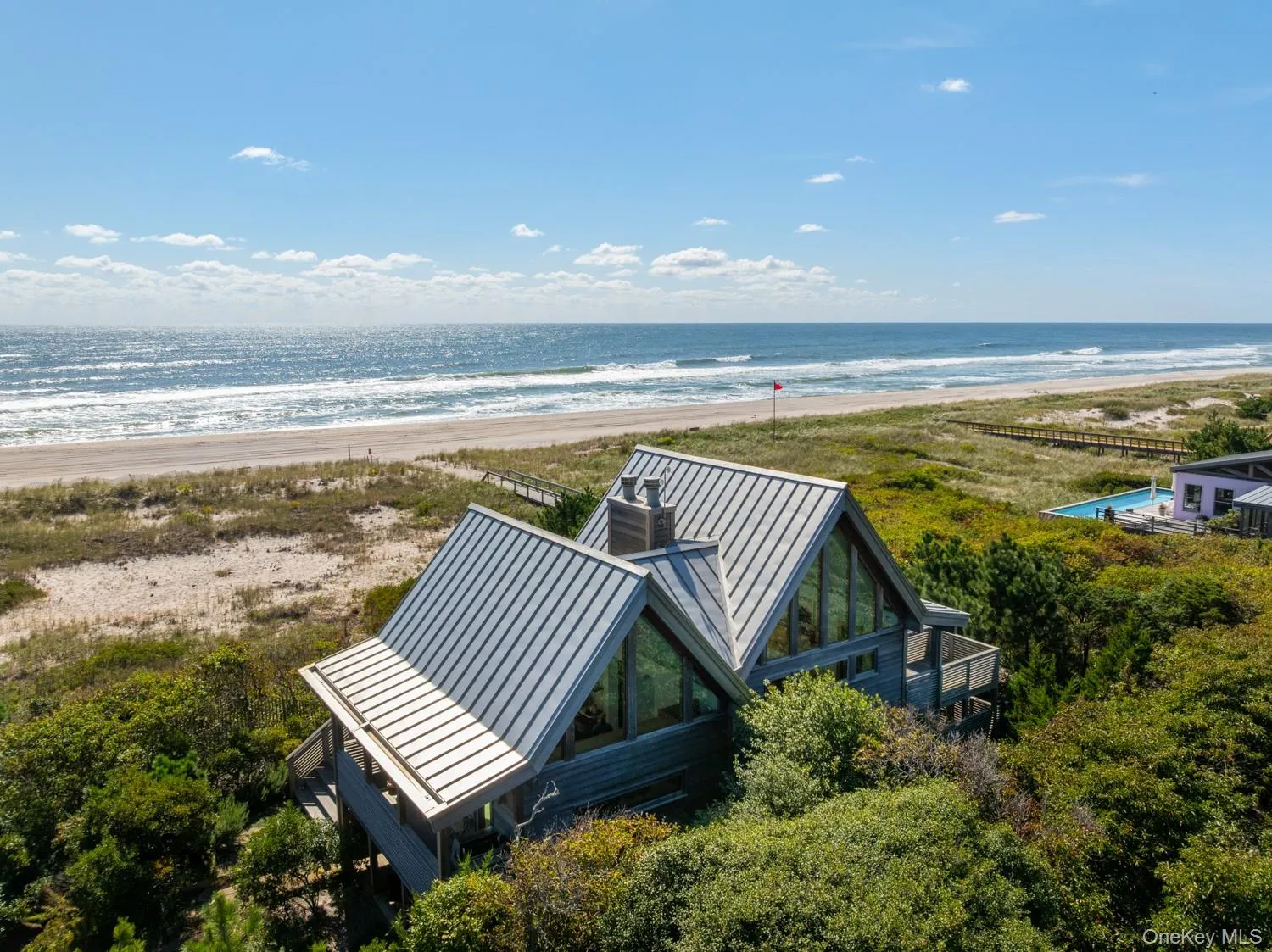 With custom made invarimate metal roof and view of the ocean. With custom made invarimate metal roof and view of the ocean.