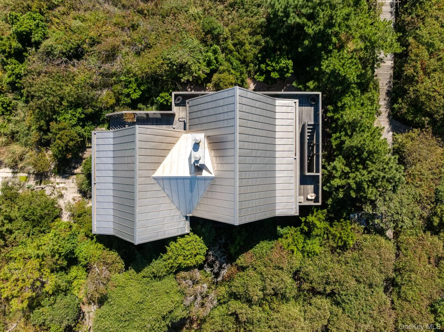 overhead view custom made invarimate metal roof surrounded by National Seashore. overhead view custom made invarimate metal roof surrounded by National Seashore.