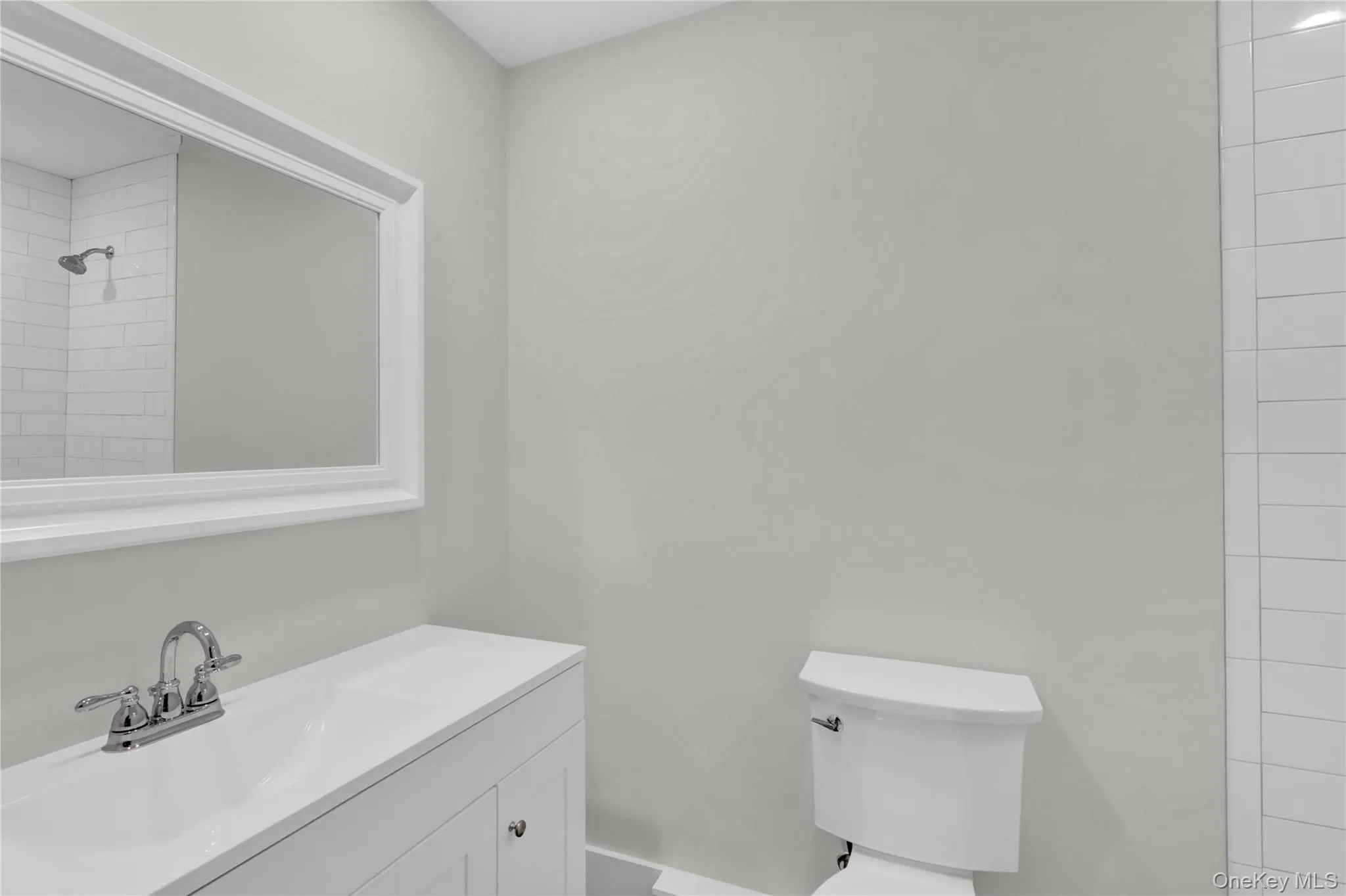 Full Hall bathroom with a tile shower and vanity Full Hall bathroom with a tile shower and vanity