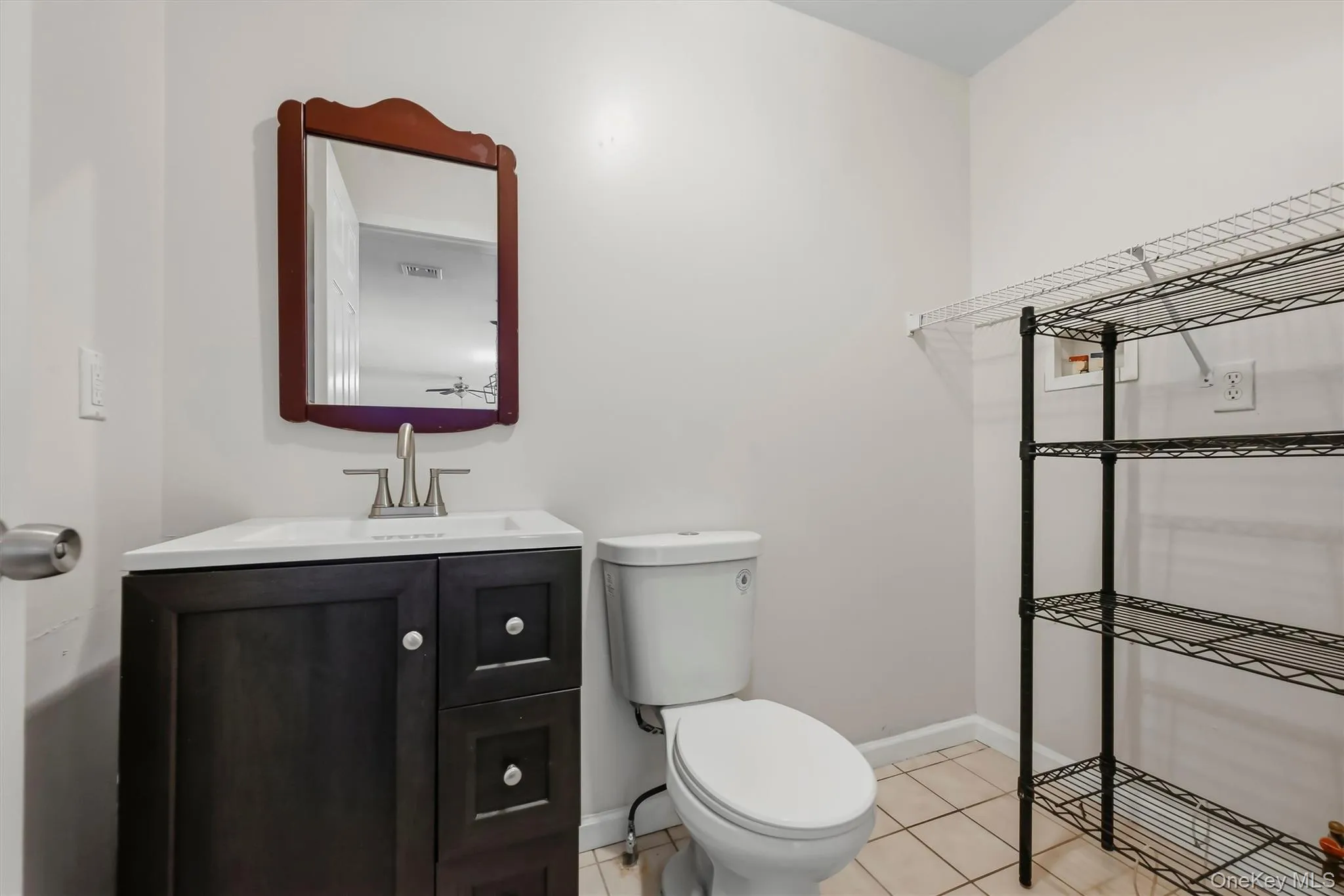 Tucked just off the kitchen, the main-level half bath adds everyday convenience without interrupting the home’s flow. Tucked just off the kitchen, the main-level half bath adds everyday convenience without interrupting the home’s flow.