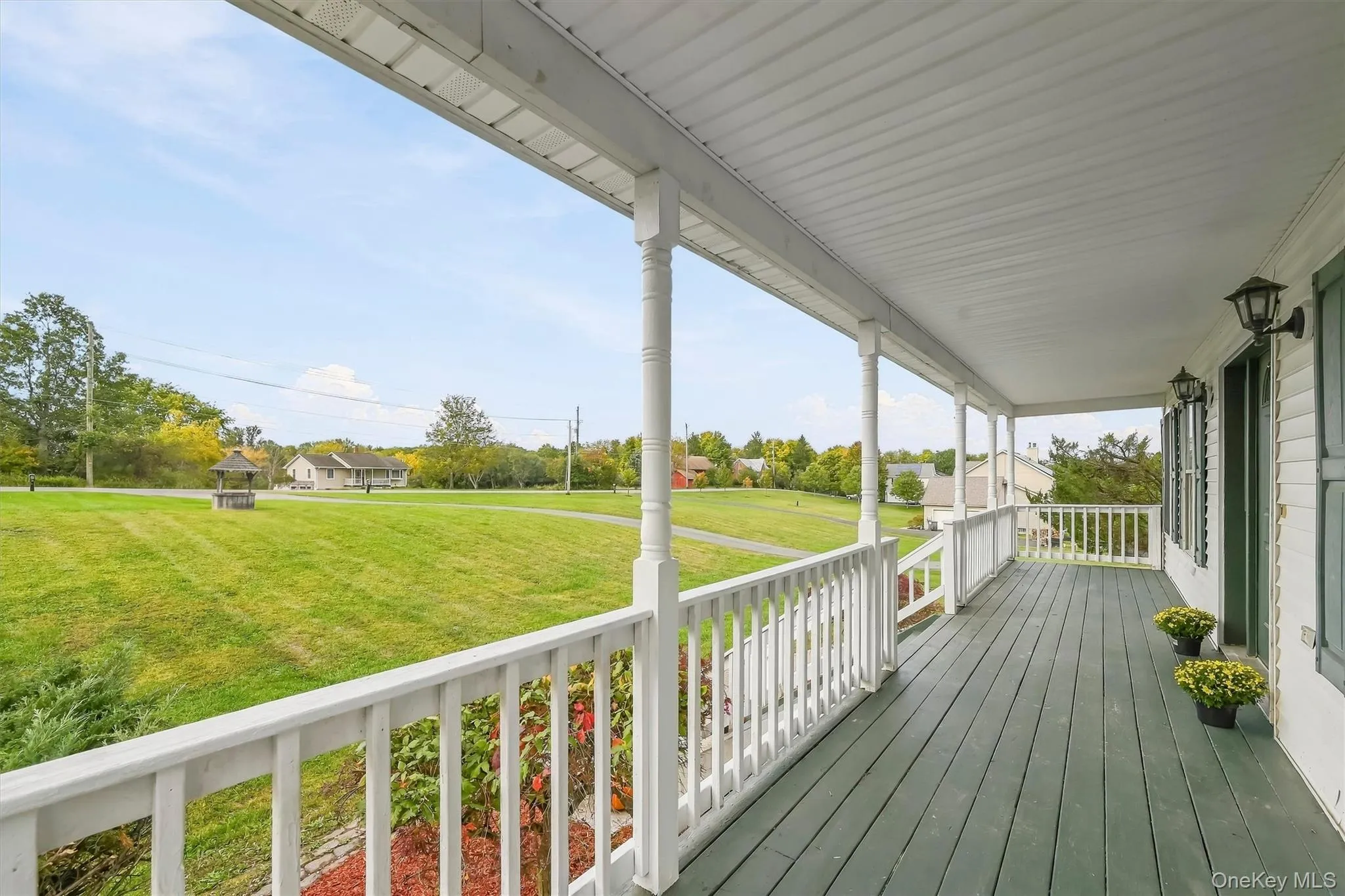 This full-length covered porch is built for coffee in the morning and quiet evenings overlooking the property. This full-length covered porch is built for coffee in the morning and quiet evenings overlooking the property.