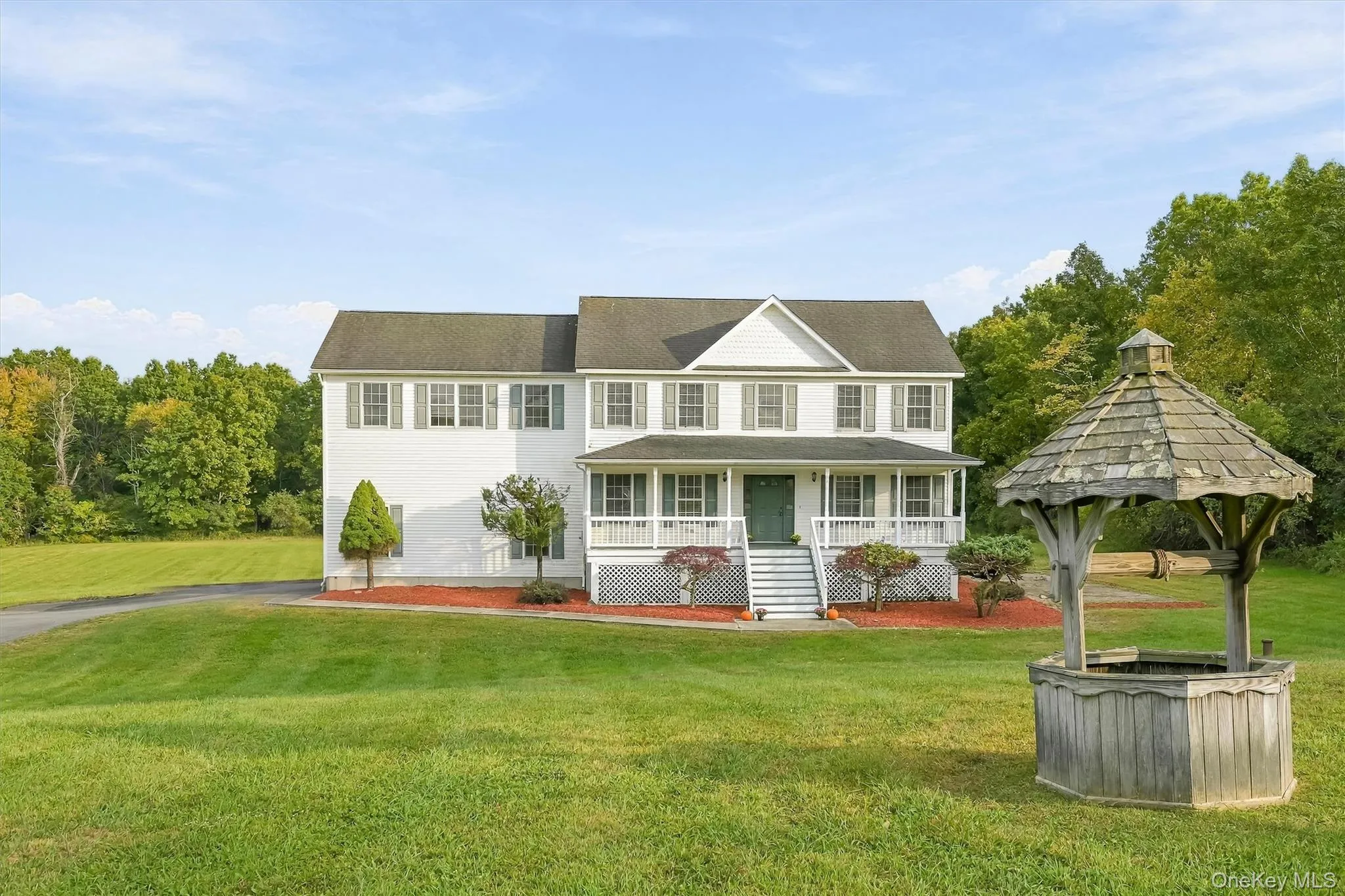 Surrounded by open lawn, the home enjoys a setting that feels spacious in every direction. Surrounded by open lawn, the home enjoys a setting that feels spacious in every direction.