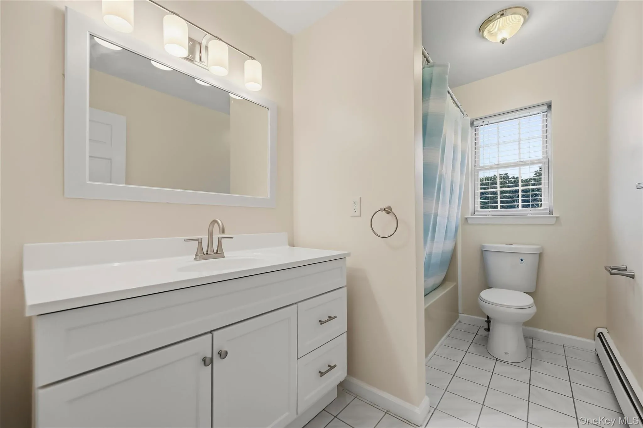 The full hall bath carries the home’s updated feel upstairs with a fresh vanity and bright finishes. The full hall bath carries the home’s updated feel upstairs with a fresh vanity and bright finishes.