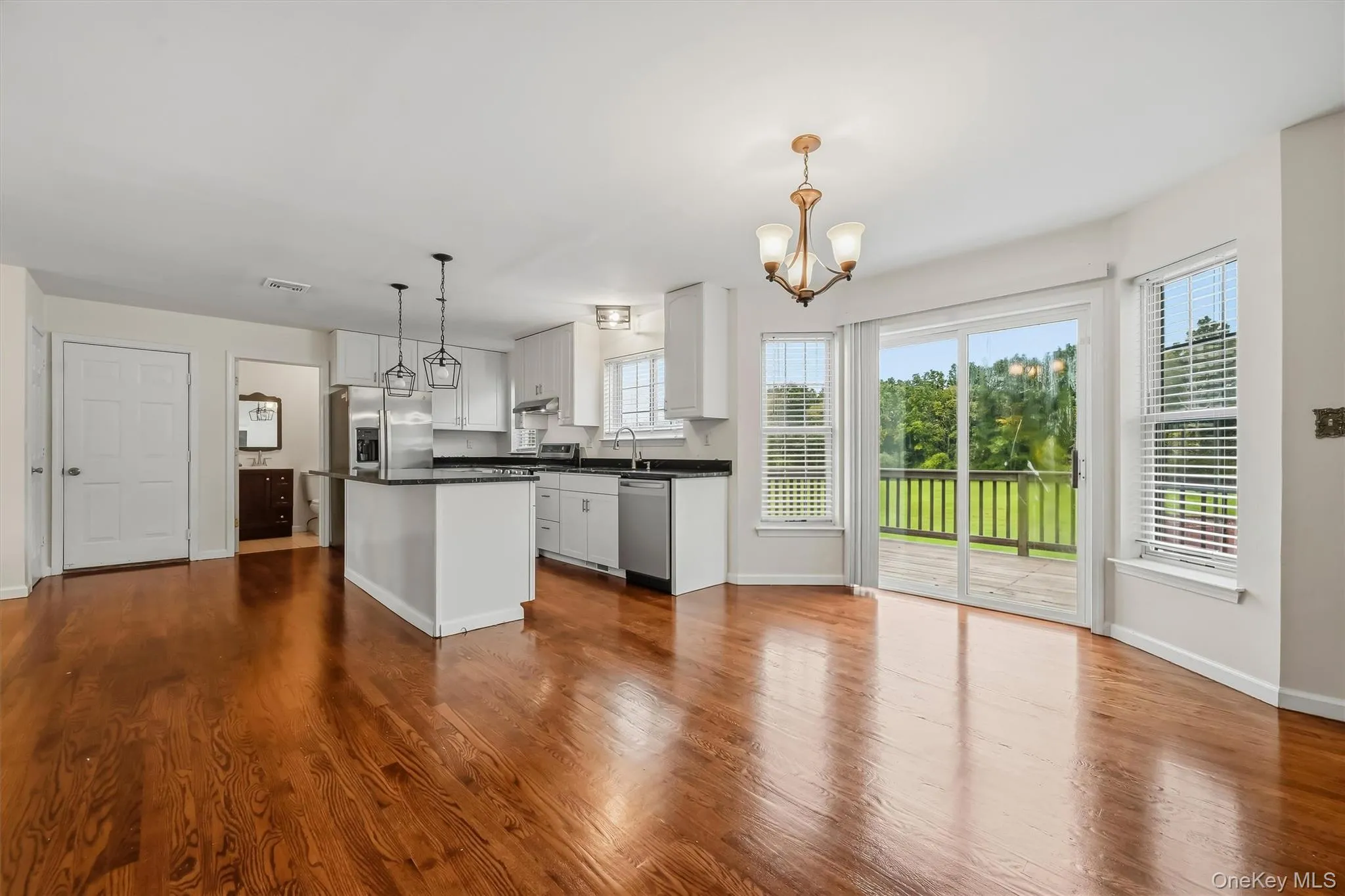 The kitchen opens directly into the dining area, with easy access to the deck and backyard beyond. The kitchen opens directly into the dining area, with easy access to the deck and backyard beyond.