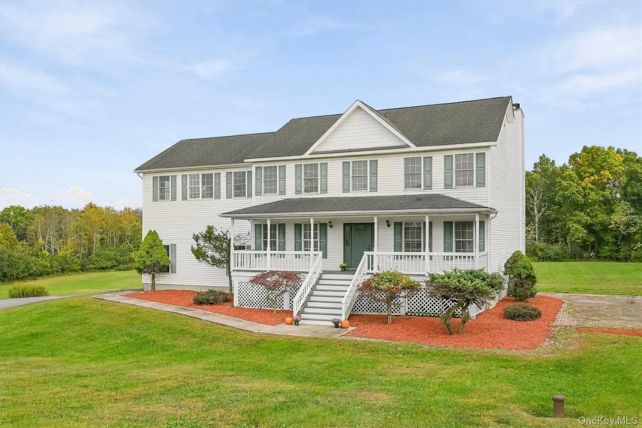 Timeless Colonial charm framed by mature landscaping and a full-length covered porch. Timeless Colonial charm framed by mature landscaping and a full-length covered porch.