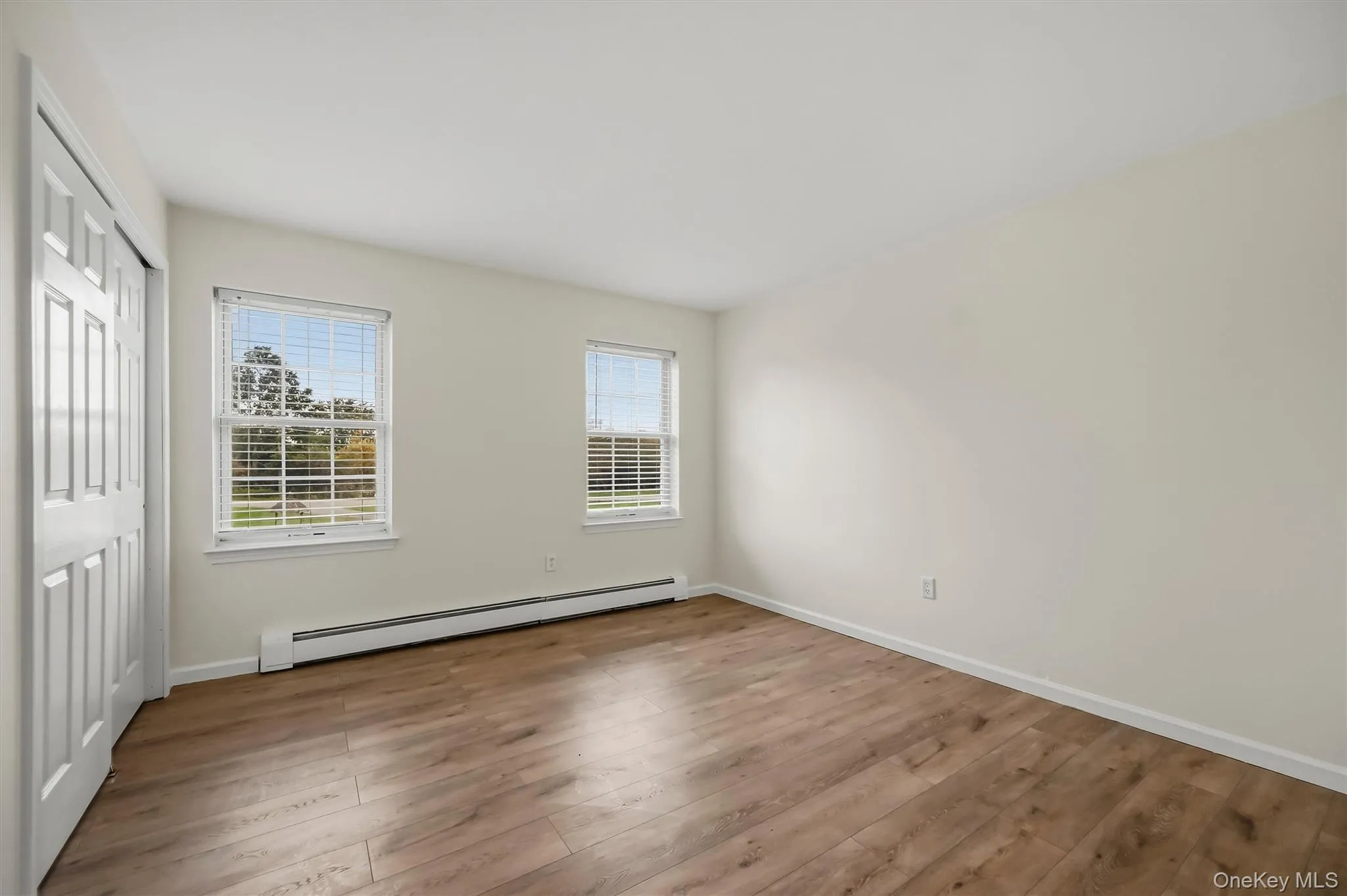 Two exposures bring natural light into this generously sized fourth bedroom. Two exposures bring natural light into this generously sized fourth bedroom.