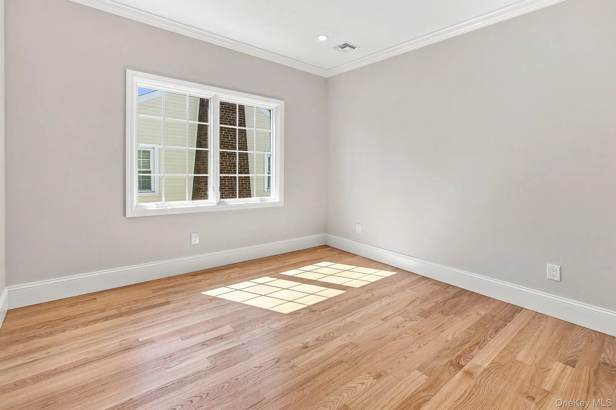 THREE additional bedrooms with hardwood flooring, crown molding, recessed lighting, white window trim, and white baseboards THREE additional bedrooms with hardwood flooring, crown molding, recessed lighting, white window trim, and white baseboards