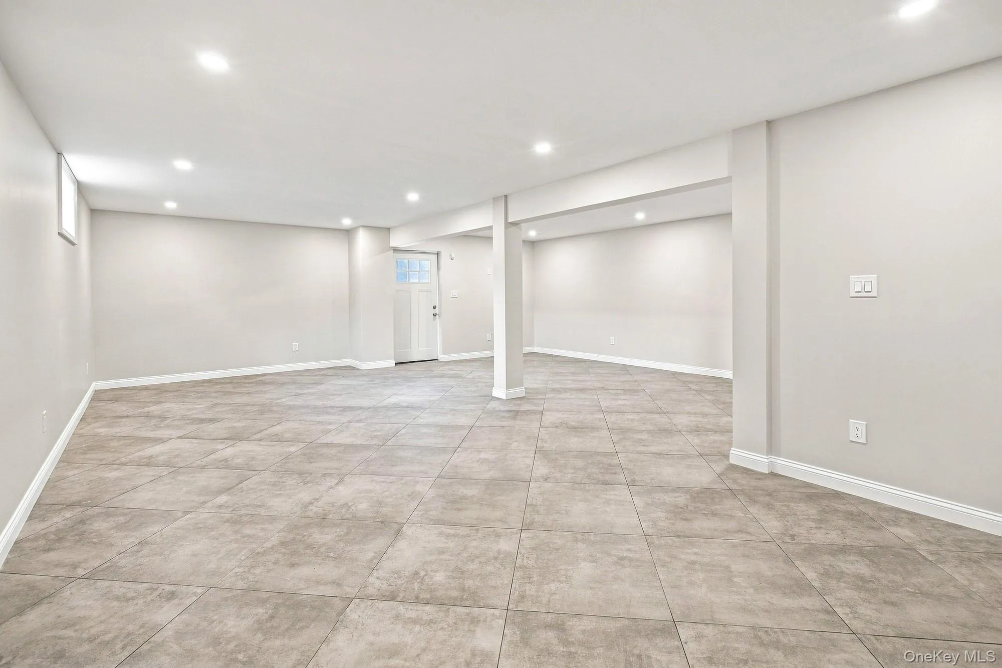 Spacious lower level featuring recessed lighting, light-toned walls, and a ceramic tile flooring. Spacious lower level featuring recessed lighting, light-toned walls, and a ceramic tile flooring.