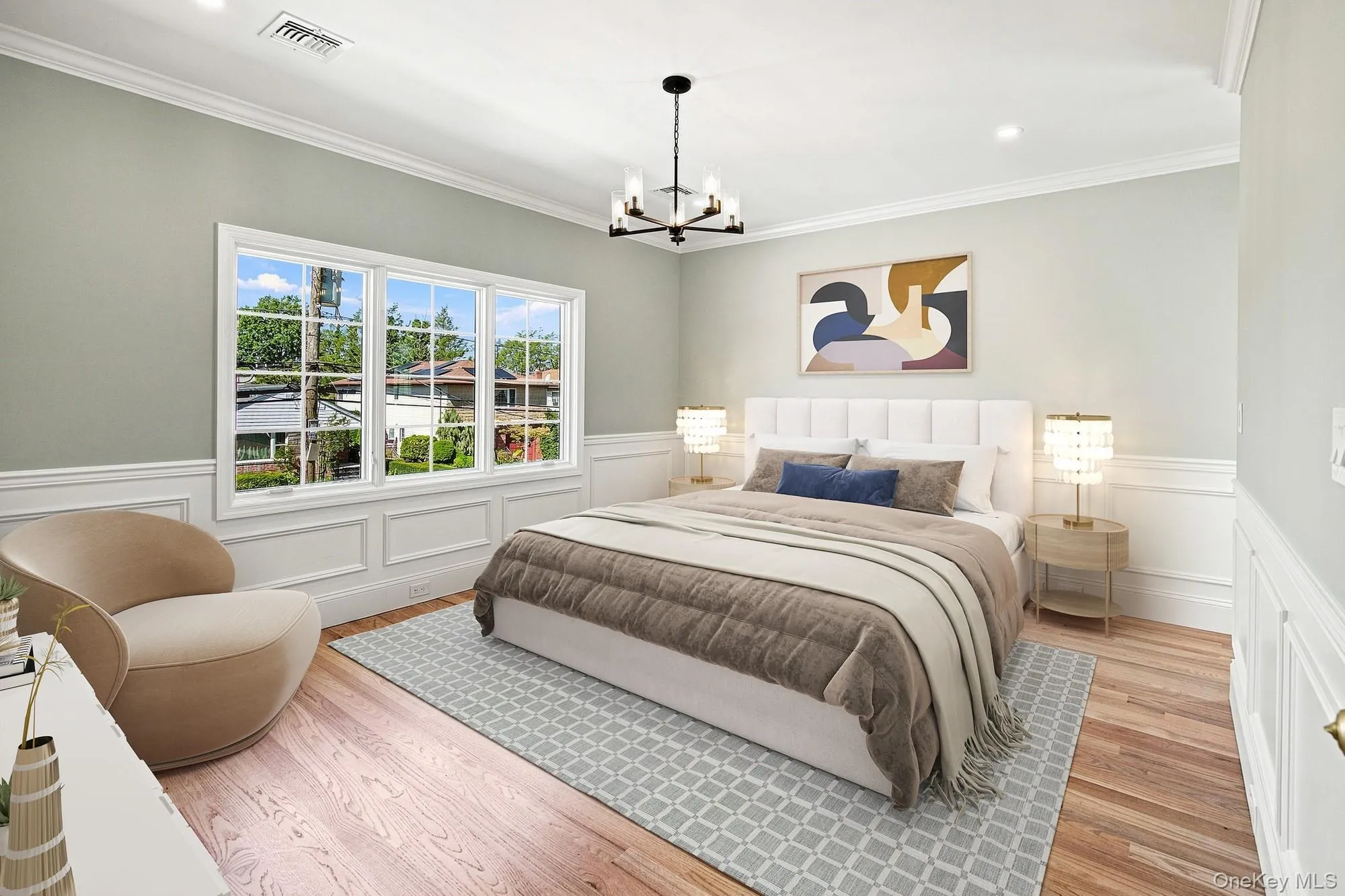 Primary Bedroom with hardwood flooring, crown molding, wainscoting, recessed lighting.VIRTUAL STAGING Primary Bedroom with hardwood flooring, crown molding, wainscoting, recessed lighting.VIRTUAL STAGING