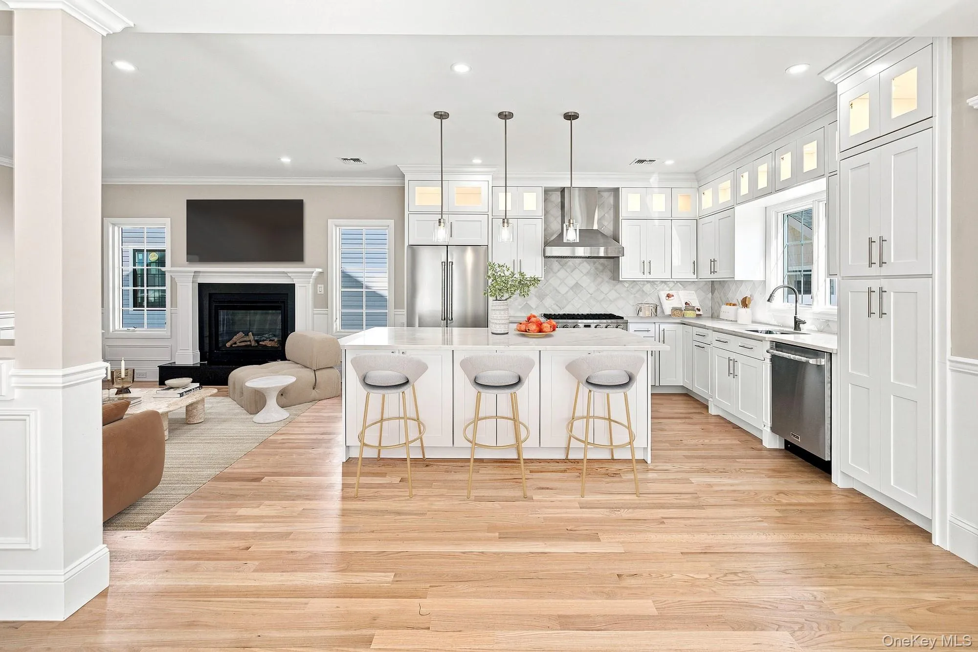 Spacious kitchen with white shaker cabinetry, stainless steel appliances, and a central island with pendant lighting.VIRTUAL STAGING Spacious kitchen with white shaker cabinetry, stainless steel appliances, and a central island with pendant lighting.VIRTUAL STAGING