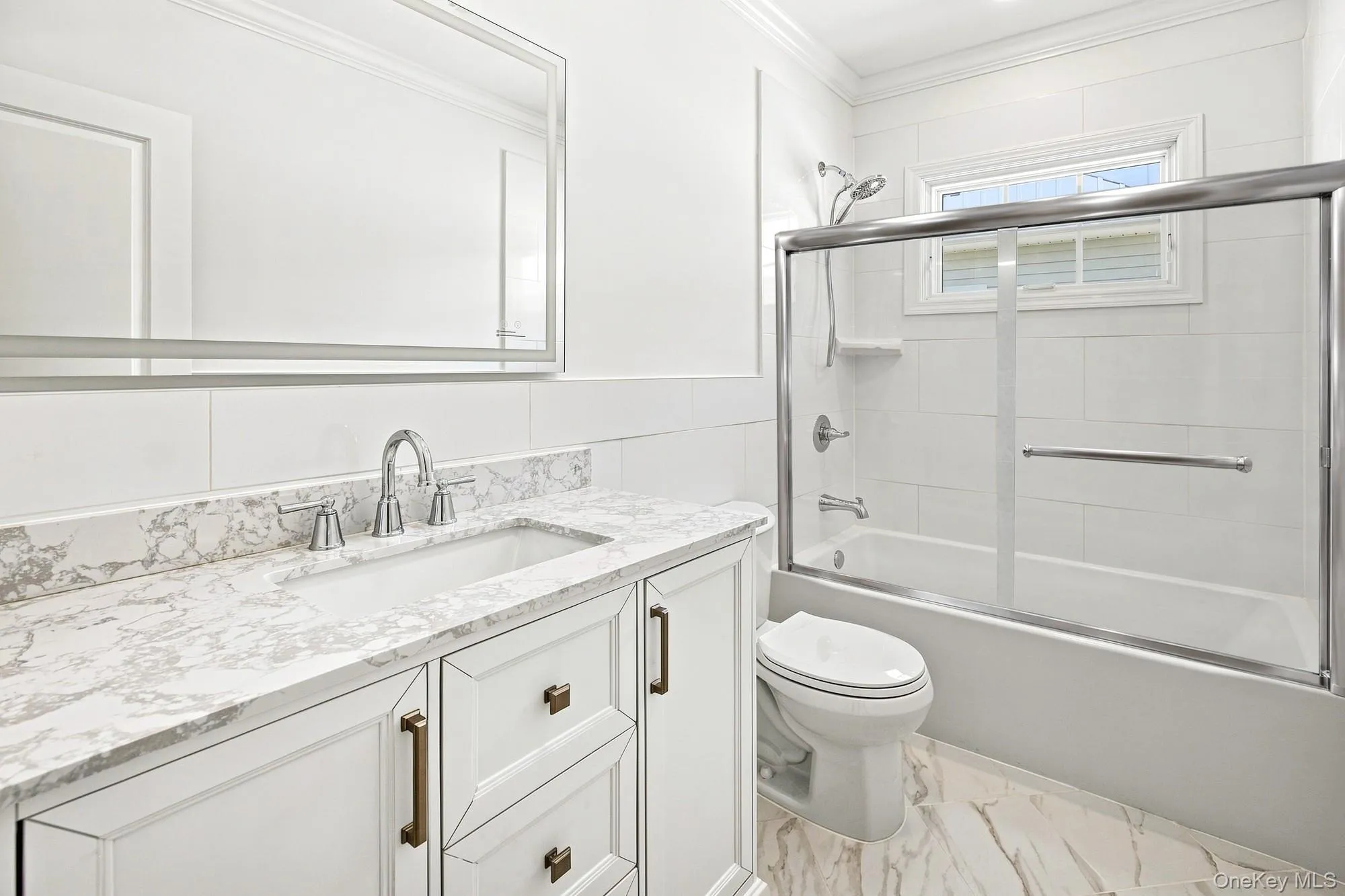 Second floor bath with white vanity with and integrated sink, complemented by stone-finish countertop Second floor bath with white vanity with and integrated sink, complemented by stone-finish countertop