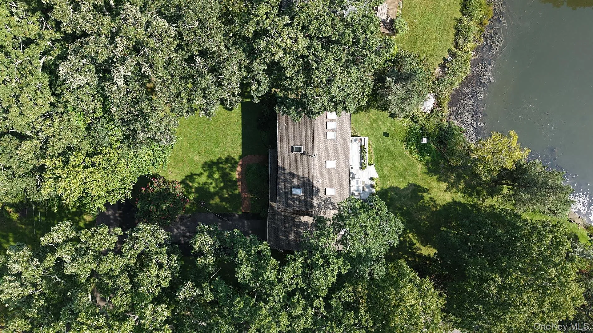 Aerial view of the home and waterfront property Aerial view of the home and waterfront property