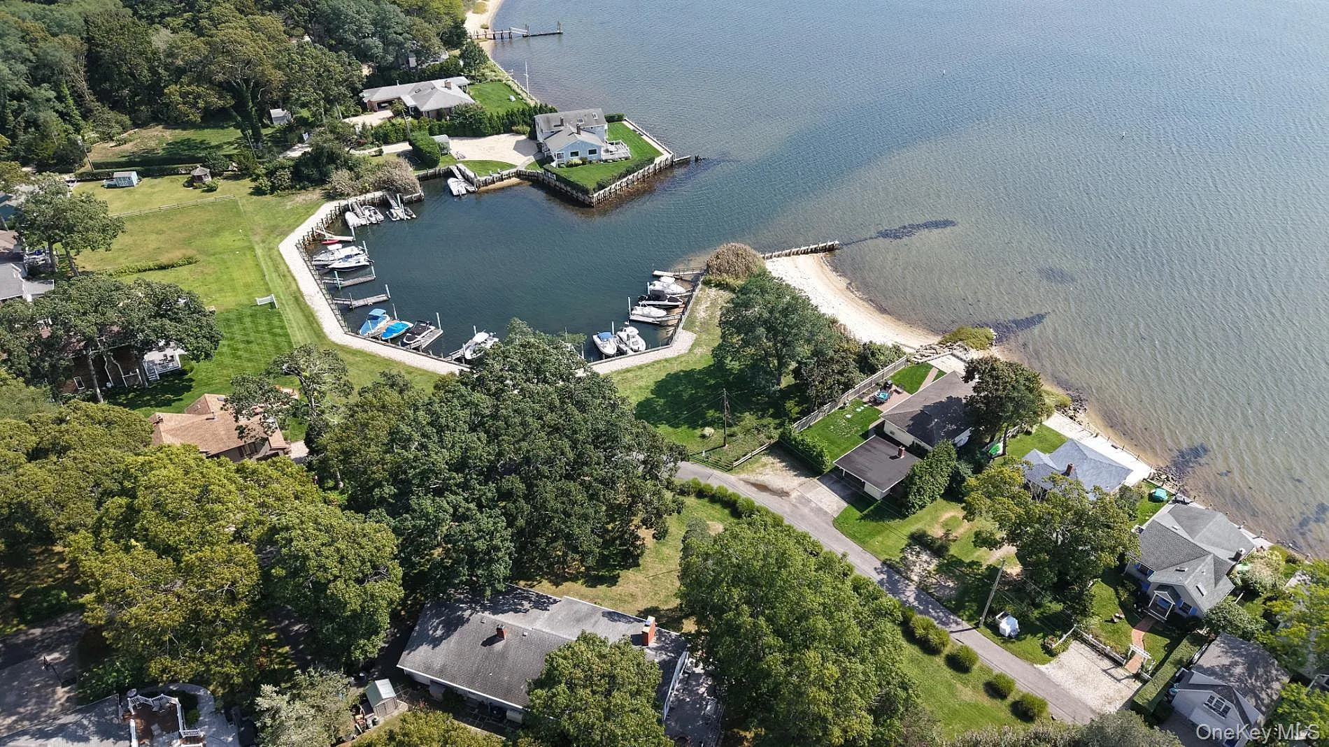 Aerial view of the marina, boat dock, and beach Aerial view of the marina, boat dock, and beach