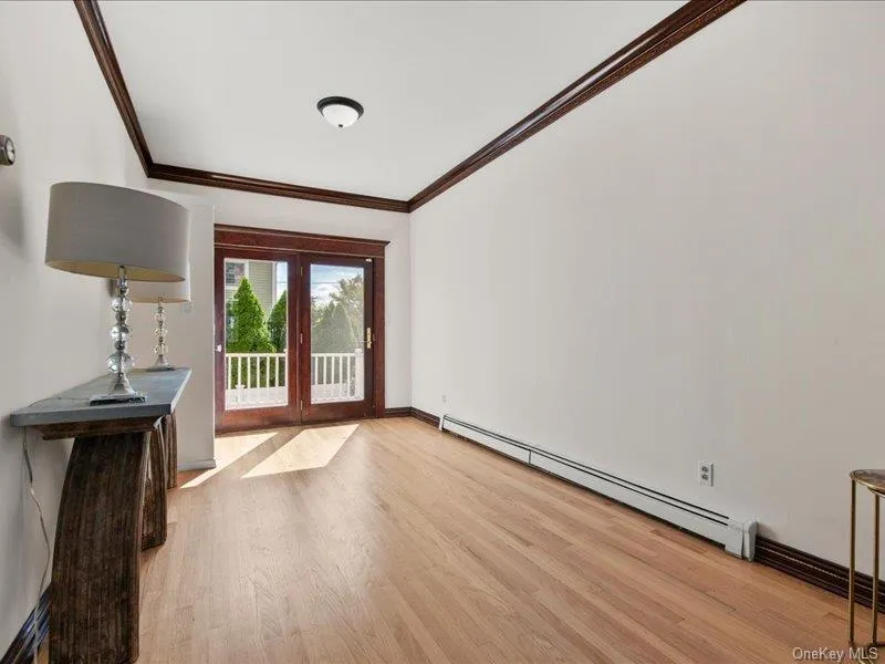 Spacious living room opens to dining room. with glass doors to rear deck Spacious living room opens to dining room. with glass doors to rear deck