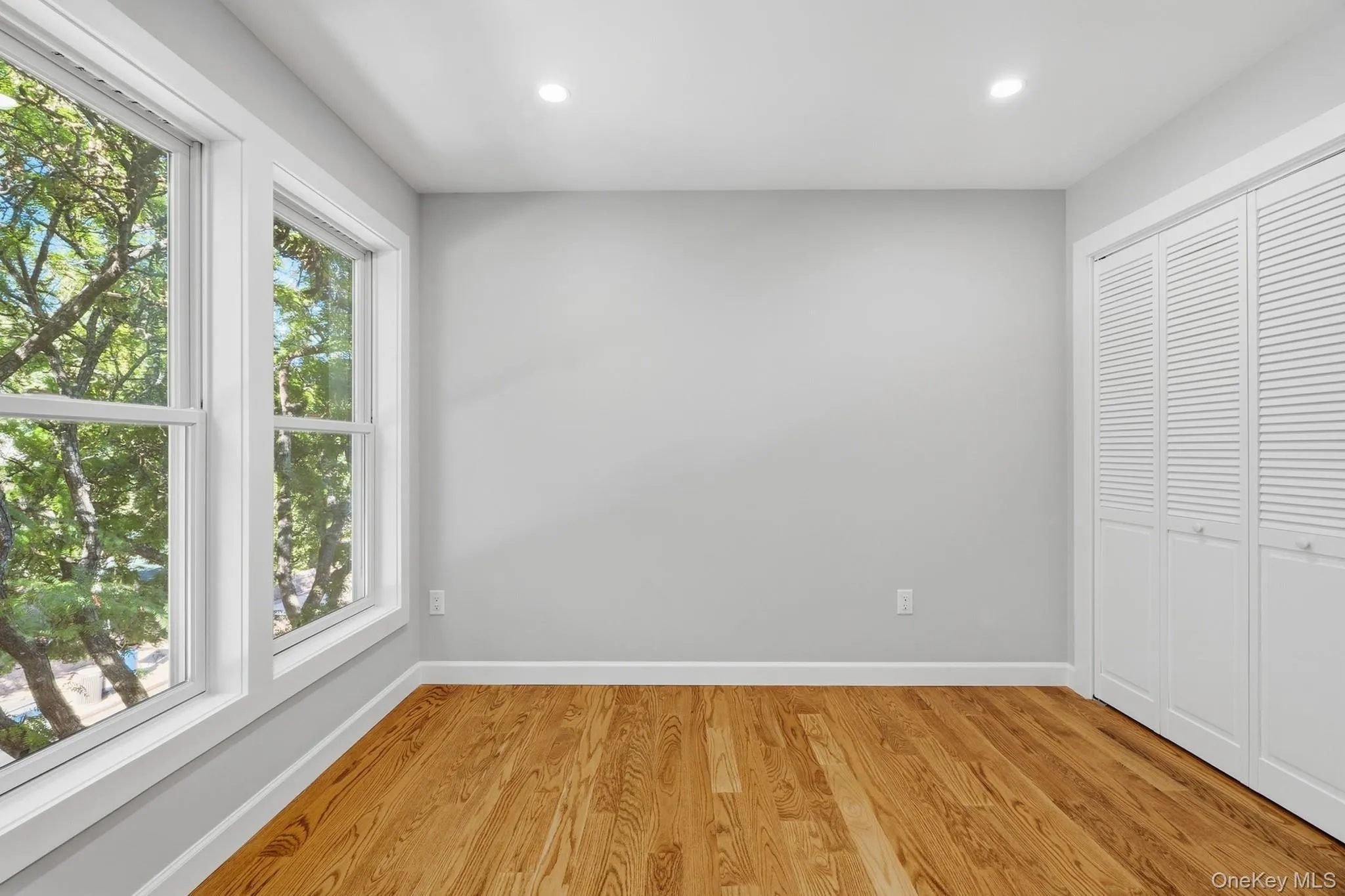 3rd Bedoom with full wall of windows, wood floors and large closet 3rd Bedoom with full wall of windows, wood floors and large closet