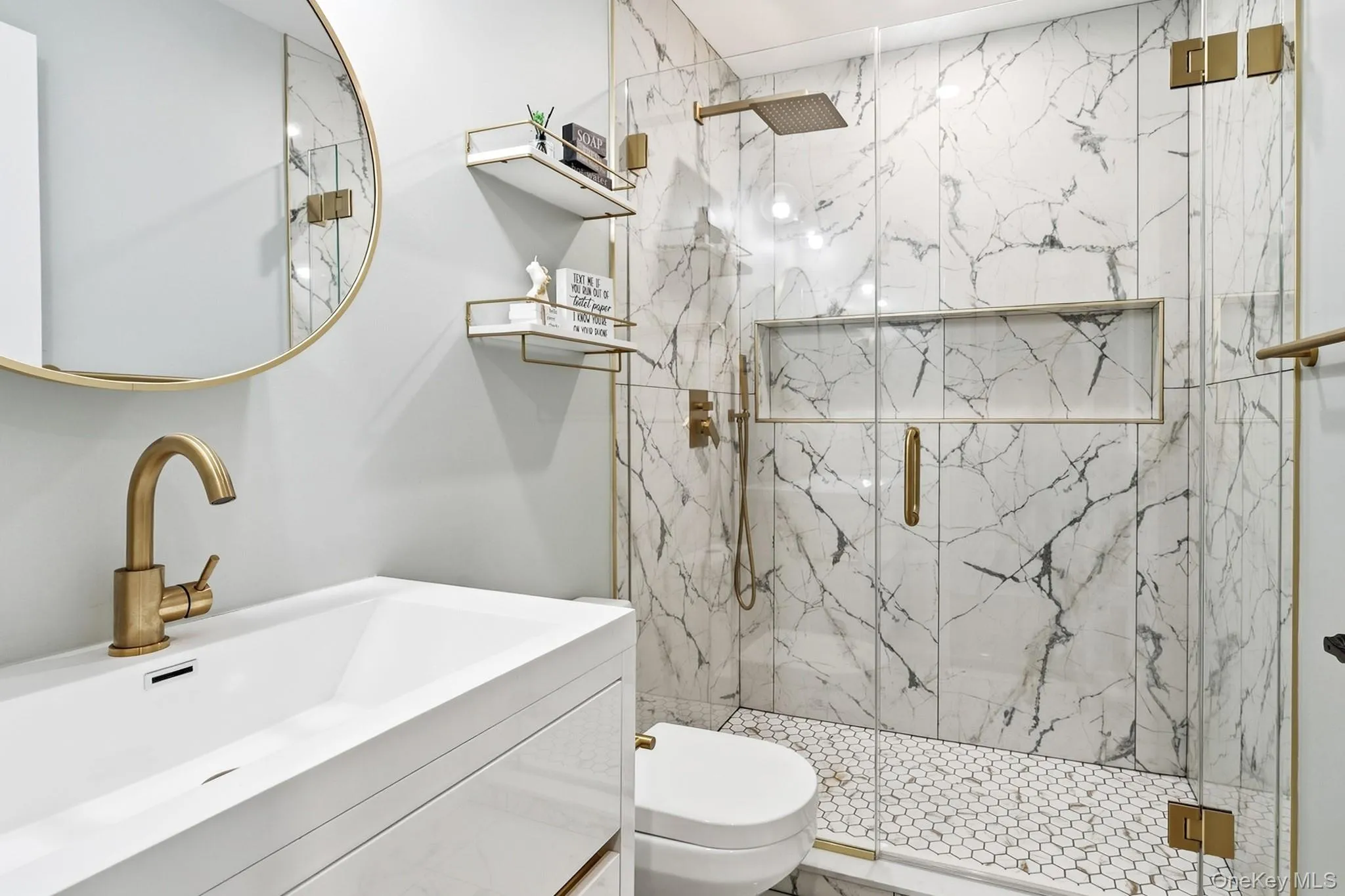 Stunning stone bathroom with walk-in shower and gold finishes Stunning stone bathroom with walk-in shower and gold finishes