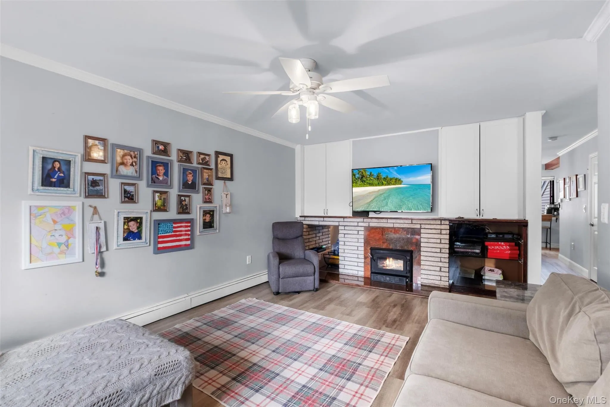 Living room with wood burning fireplace, crown molding Living room with wood burning fireplace, crown molding