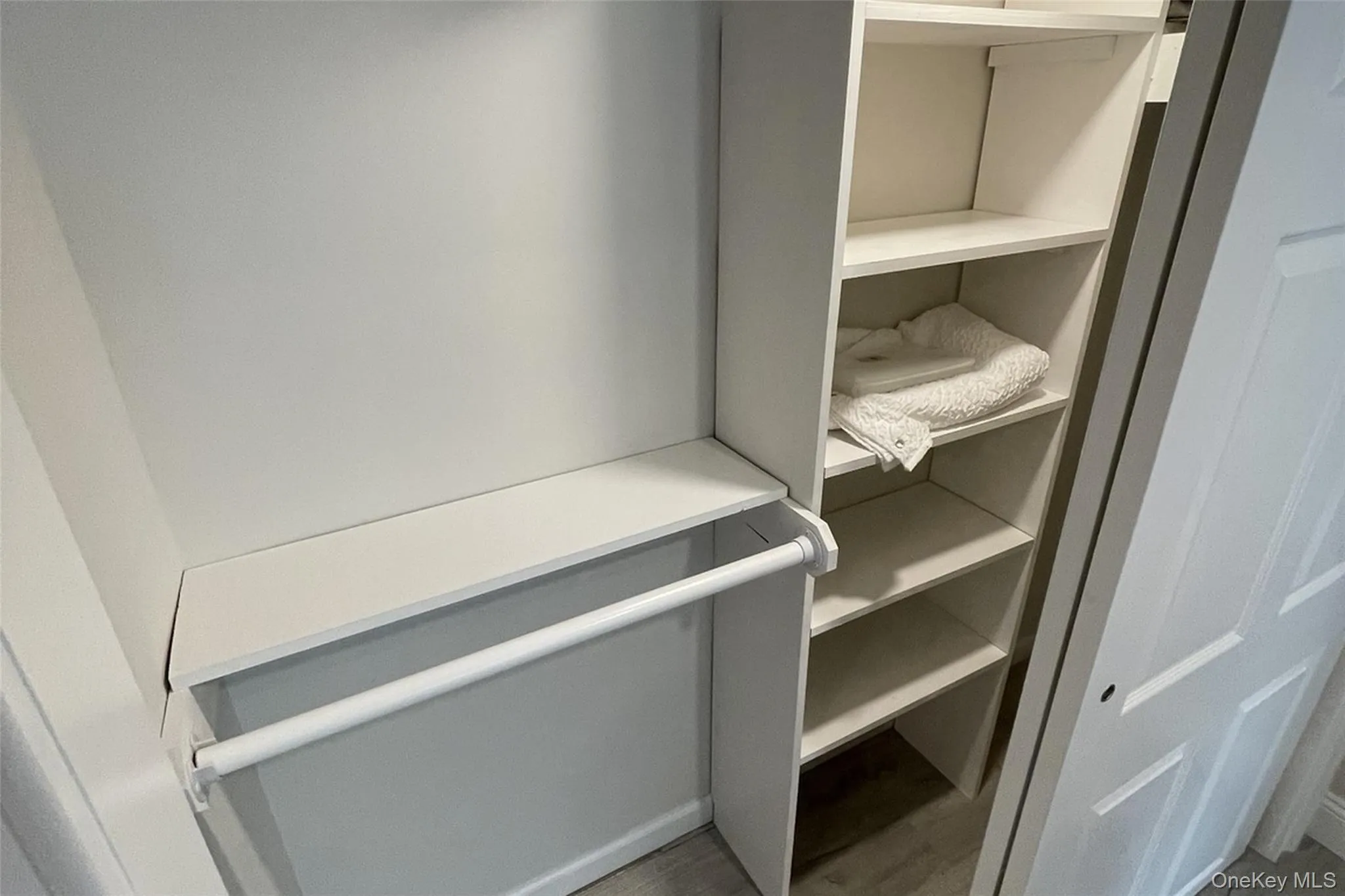 Primary Closet with Organizers Primary Closet with Organizers
