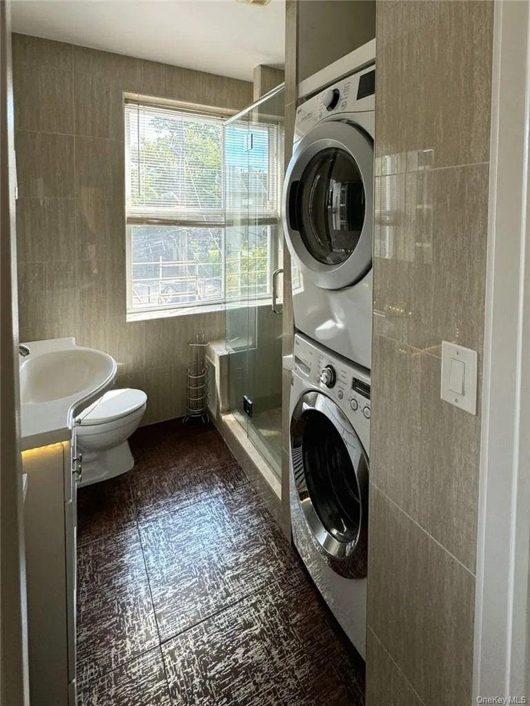 Bathroom with stacked washer / dryer Bathroom with stacked washer / dryer