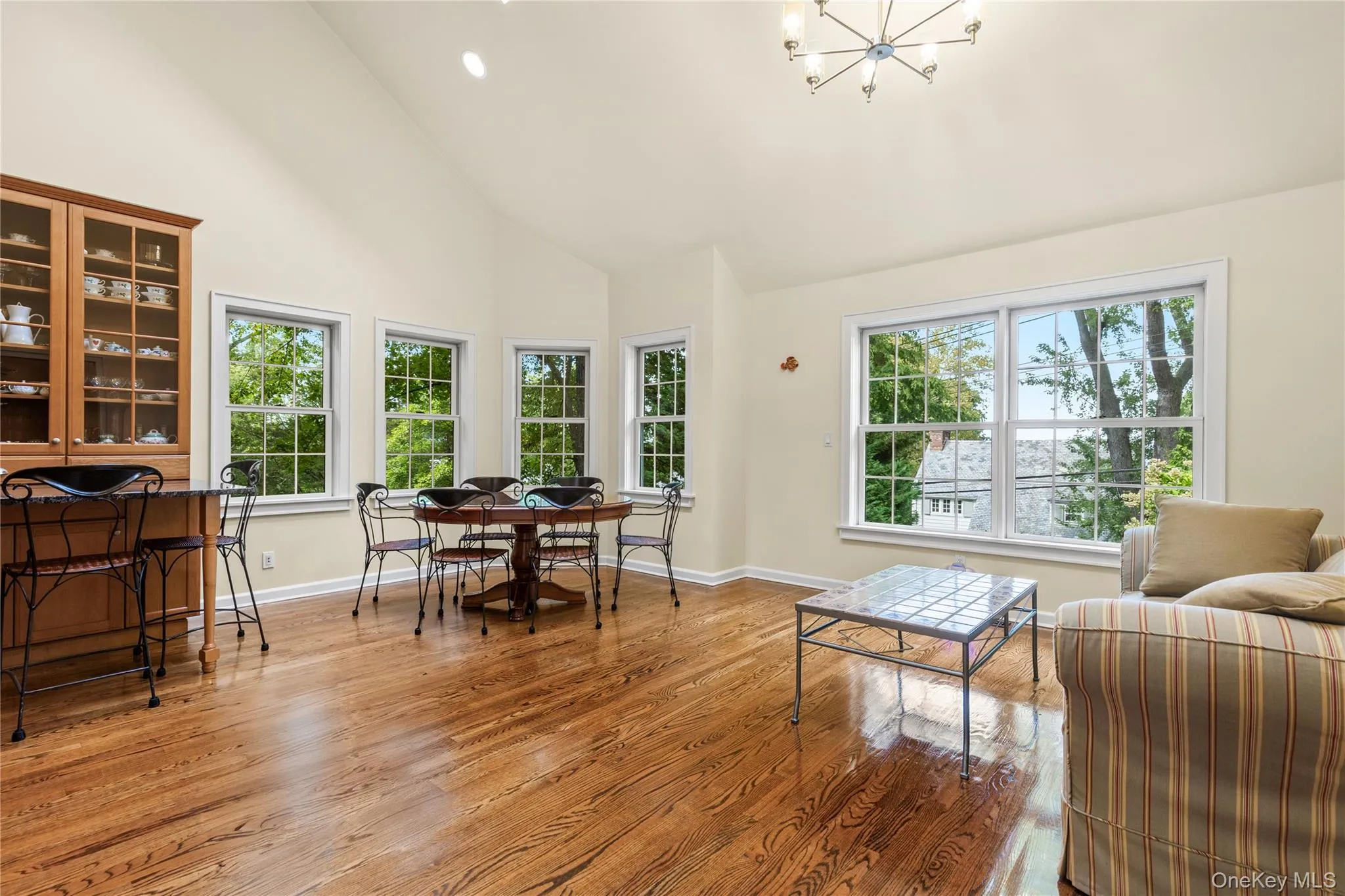 Expansive sunfilled kitchen with high ceilings, breakfast area and sitting area Expansive sunfilled kitchen with high ceilings, breakfast area and sitting area