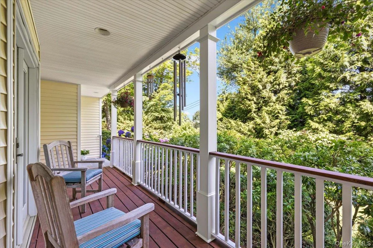 Rocking chair porch with views to beautifully landscaped yard Rocking chair porch with views to beautifully landscaped yard