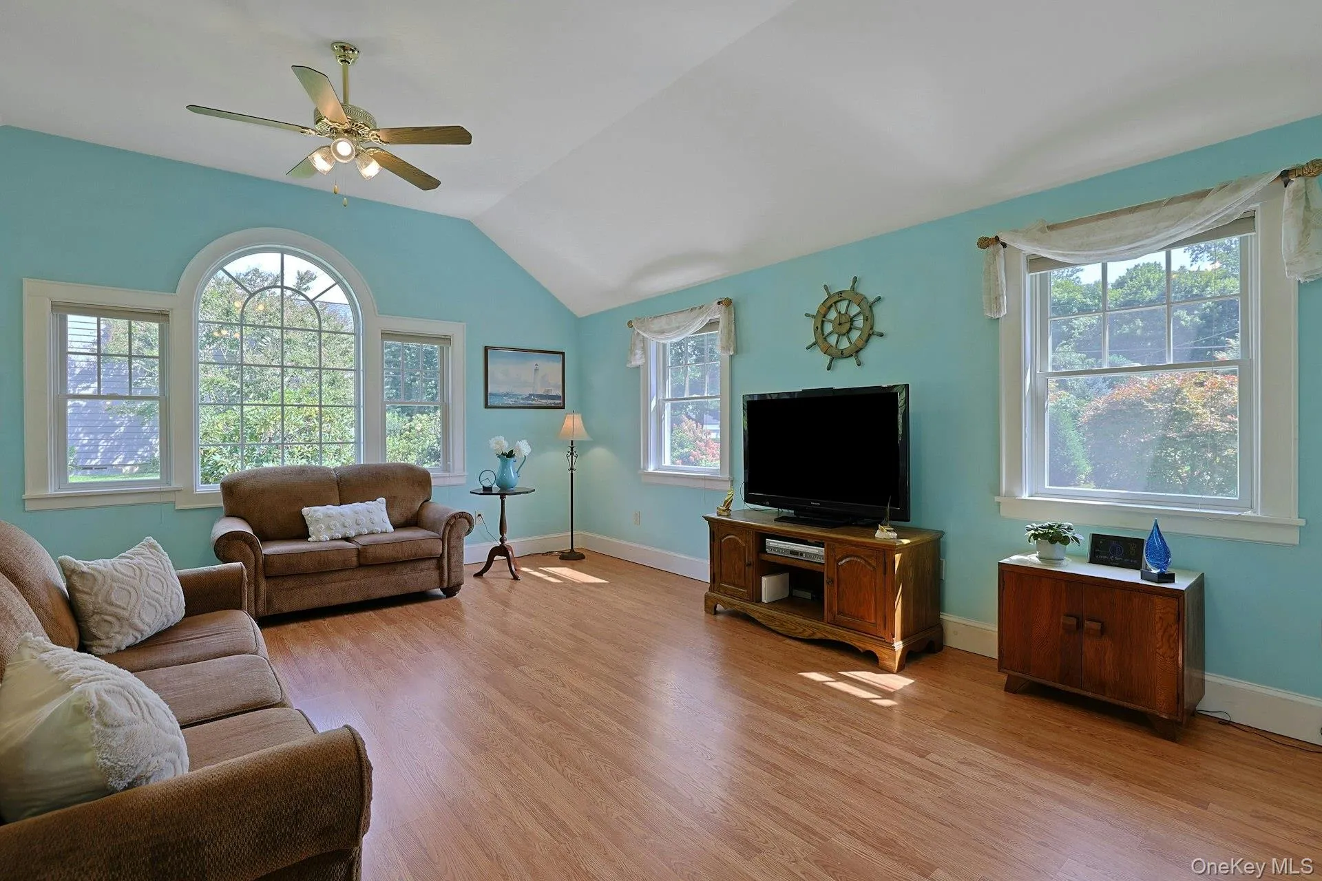 Oversized family room with vaulted ceiling, tons of light and sliding doors to level yard Oversized family room with vaulted ceiling, tons of light and sliding doors to level yard