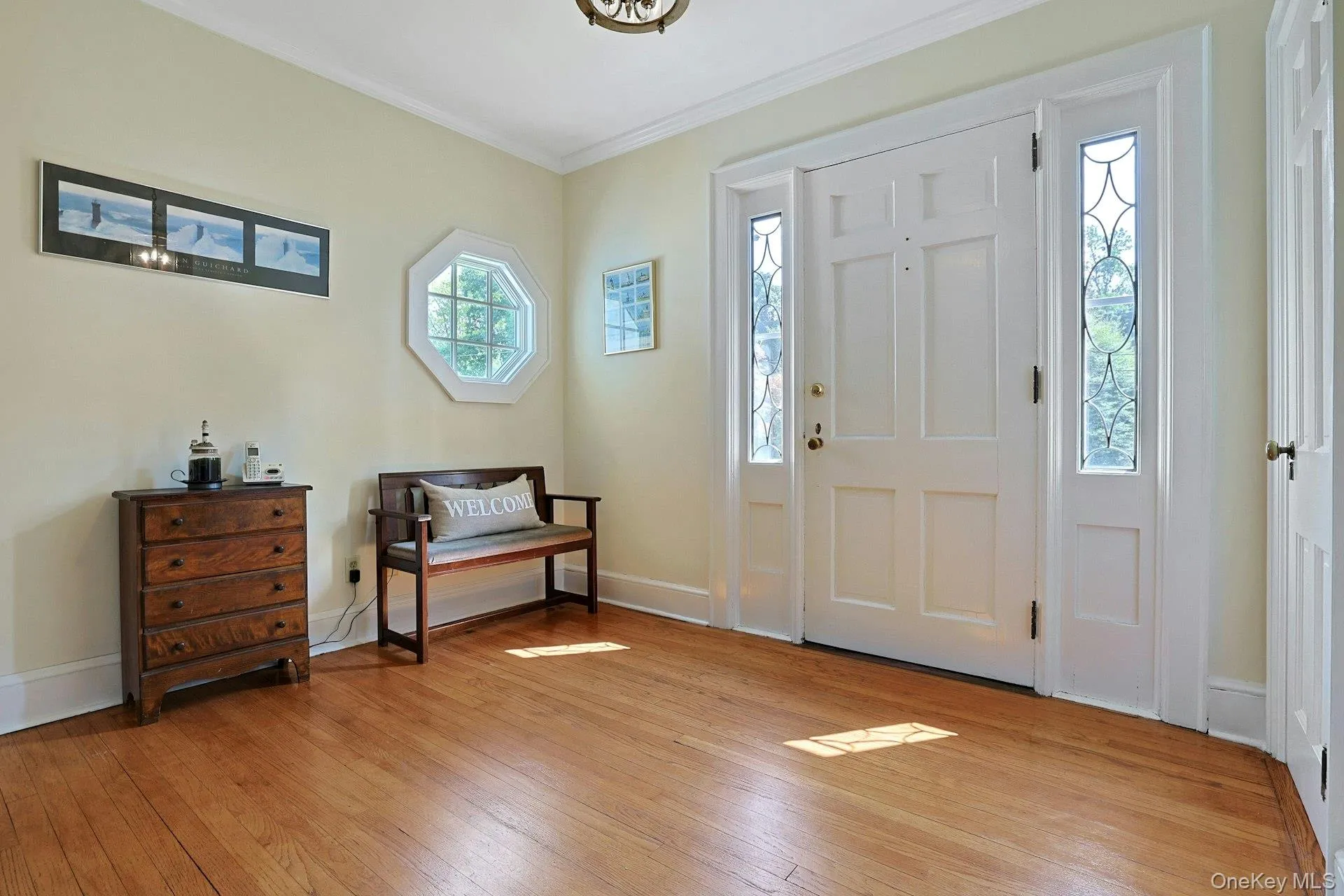 Welcoming foyer. Coat closet, charming window and sidelights. Welcoming foyer. Coat closet, charming window and sidelights.