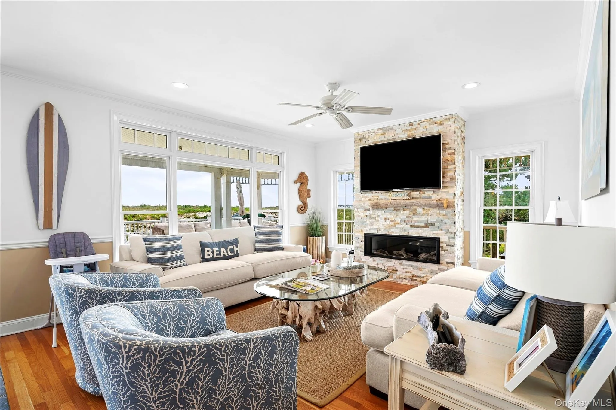 Nautical vibes living spaces with stone fireplace and stunning Oceanfront views Nautical vibes living spaces with stone fireplace and stunning Oceanfront views
