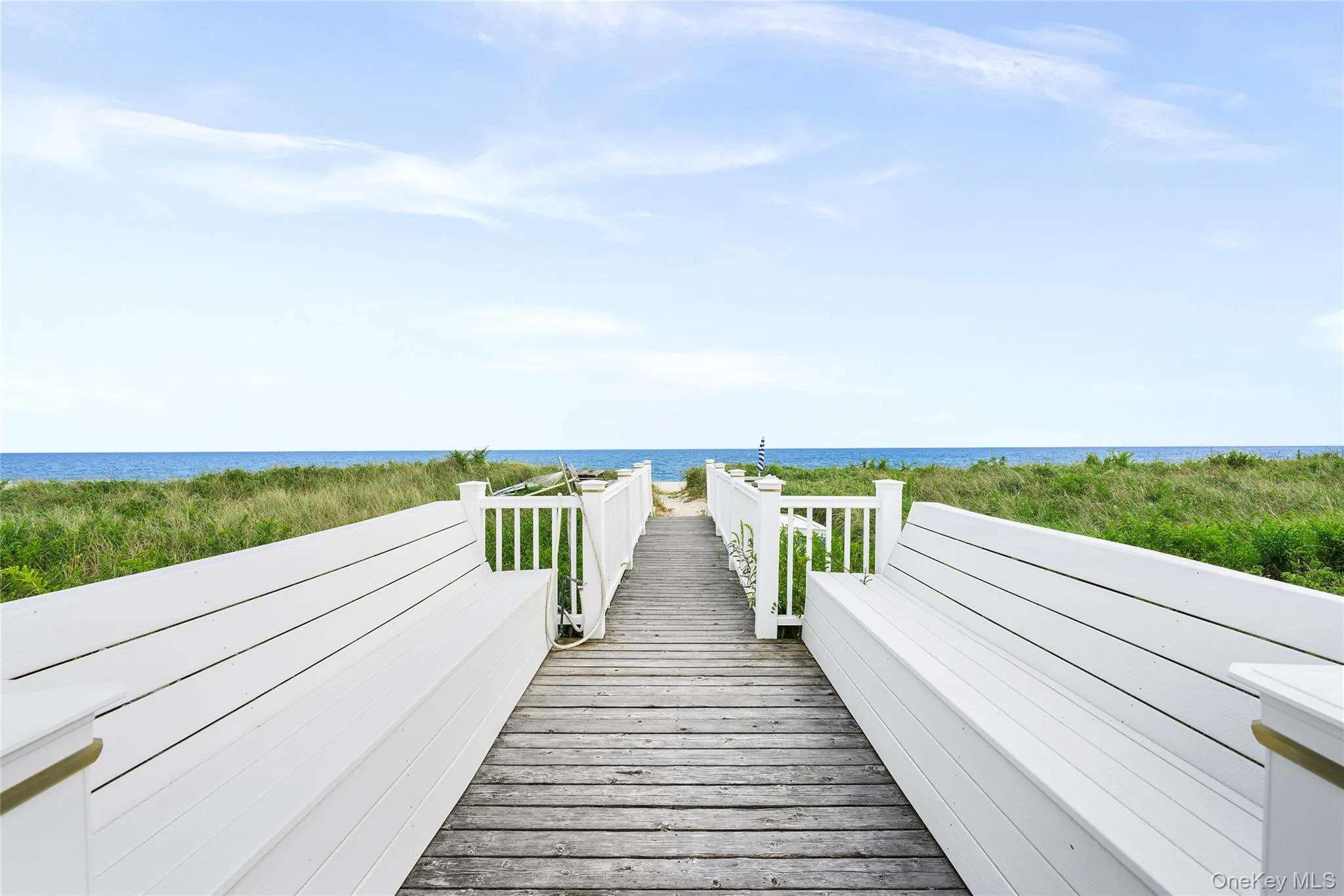 Private oceanfront boardwalk with double dune deck benches. Private oceanfront boardwalk with double dune deck benches.
