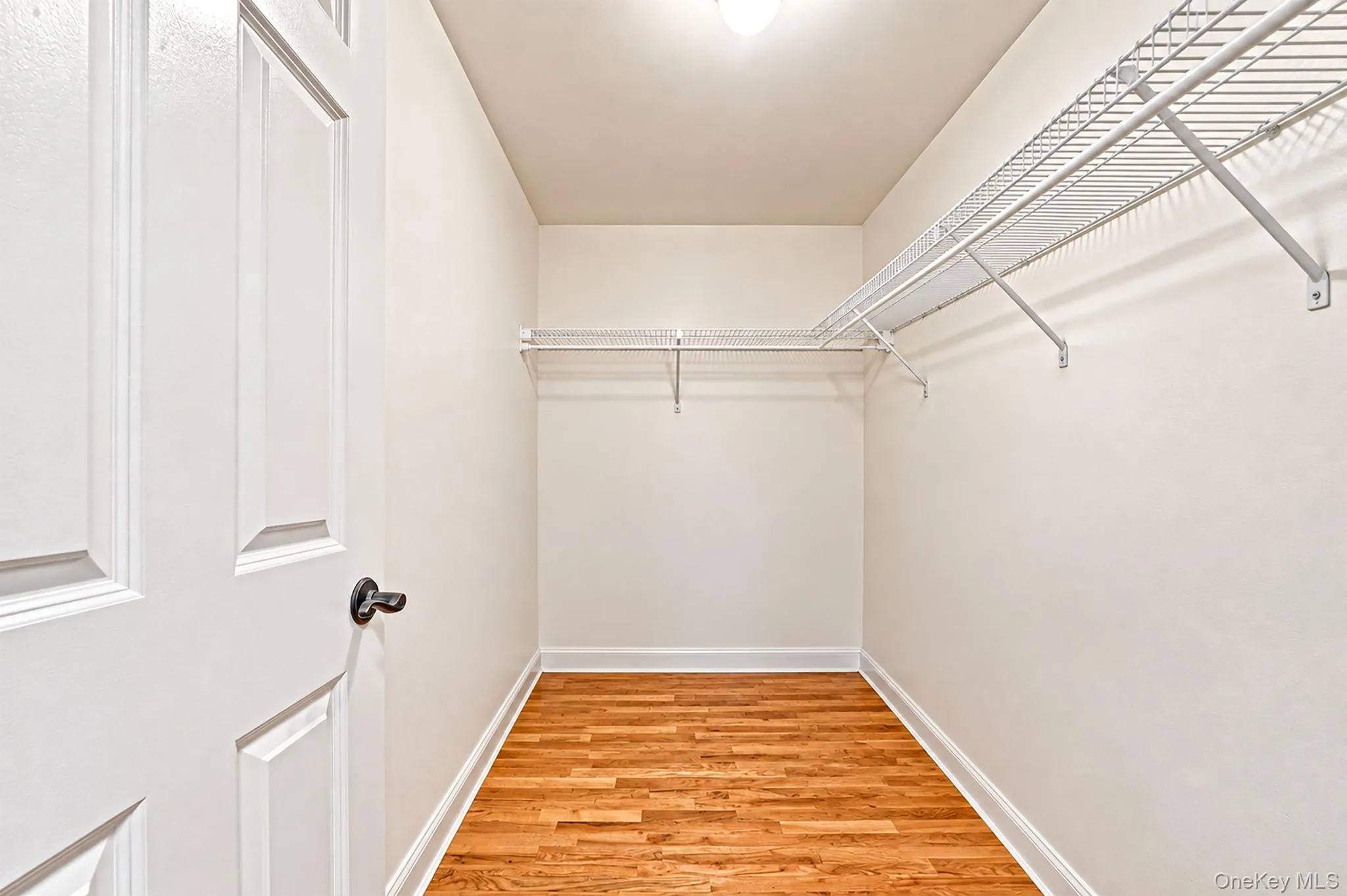 Primary Suite- First Walk-in Closet Primary Suite- First Walk-in Closet
