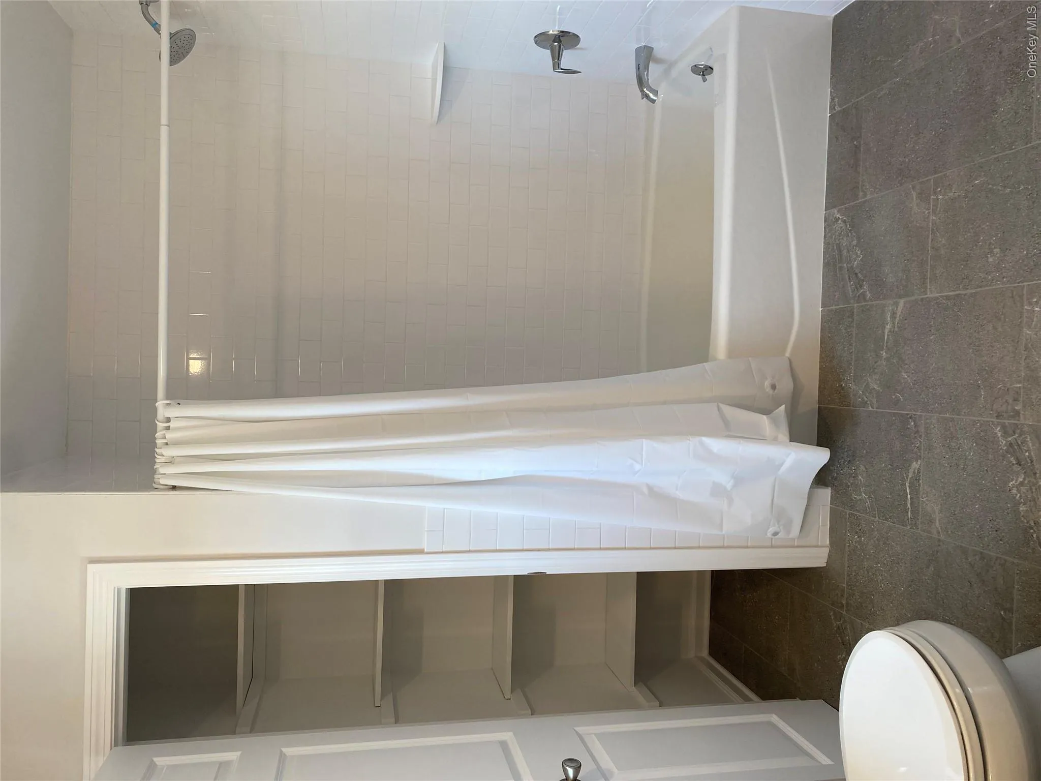 Full bathroom with shower / tub combo and toilet Full bathroom with shower / tub combo and toilet