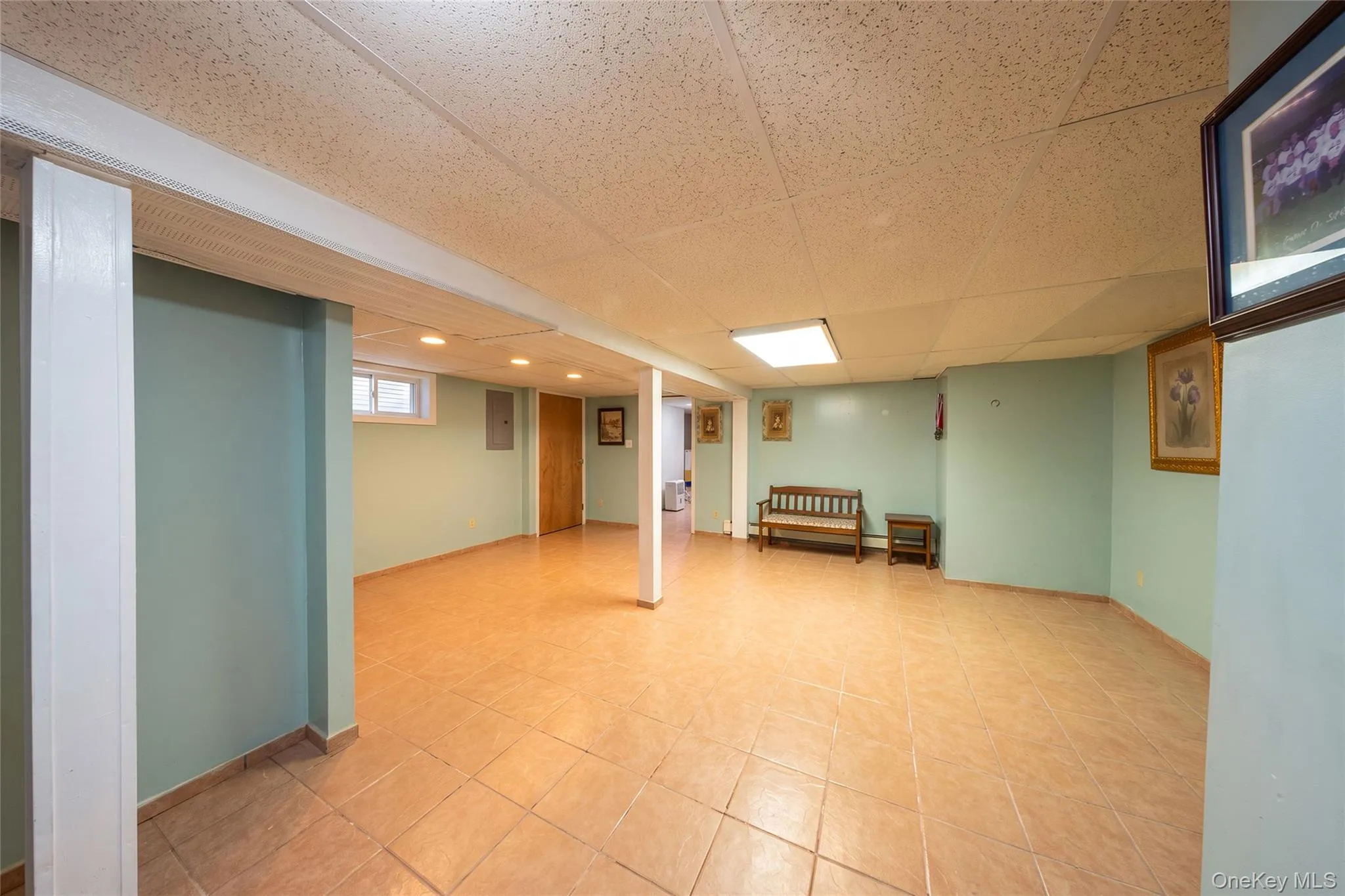 Recessed lighting, tile flooring, drop ceiling, and painted walls Recessed lighting, tile flooring, drop ceiling, and painted walls