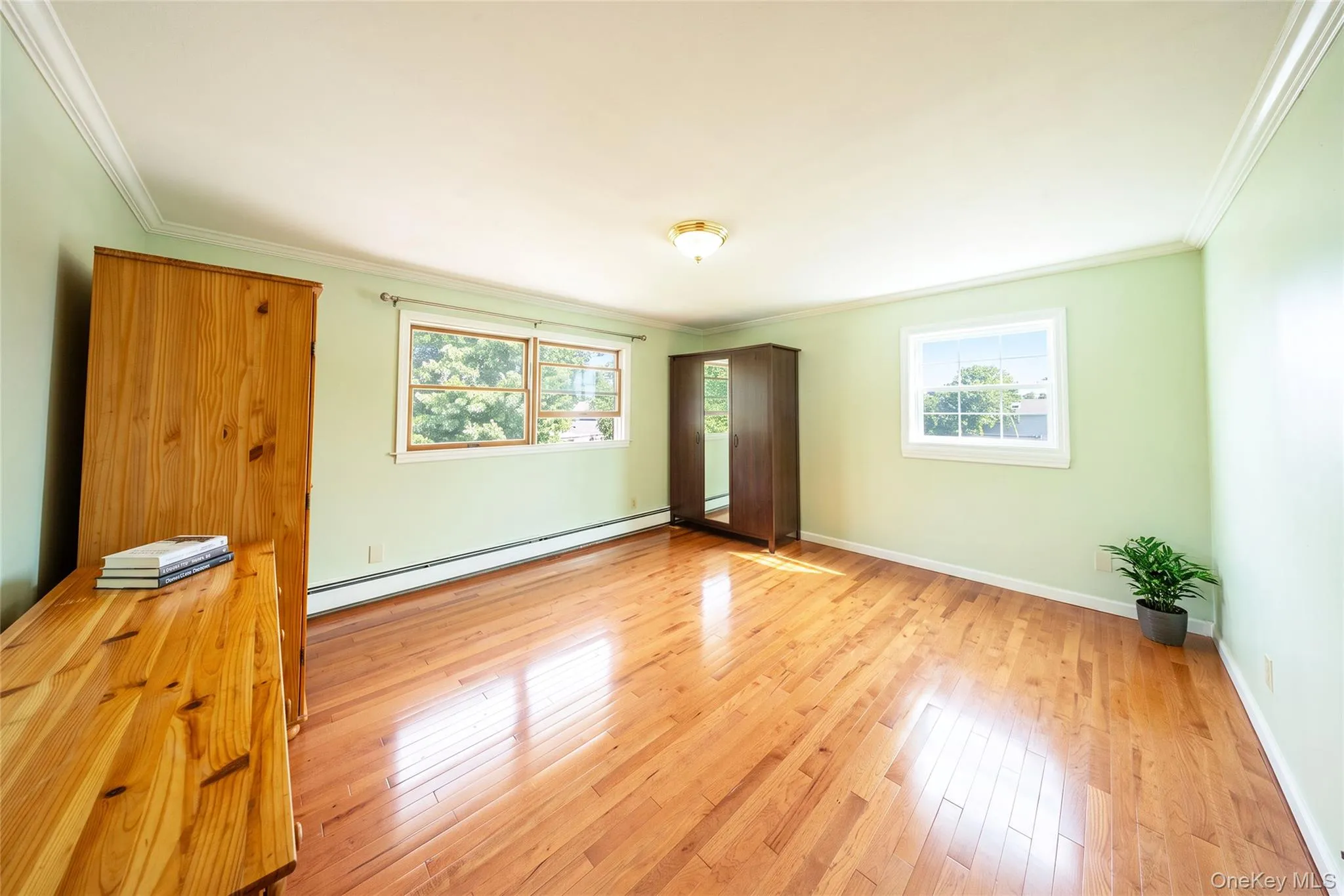 Hardwood flooring, crown molding, double window, and recessed window Hardwood flooring, crown molding, double window, and recessed window