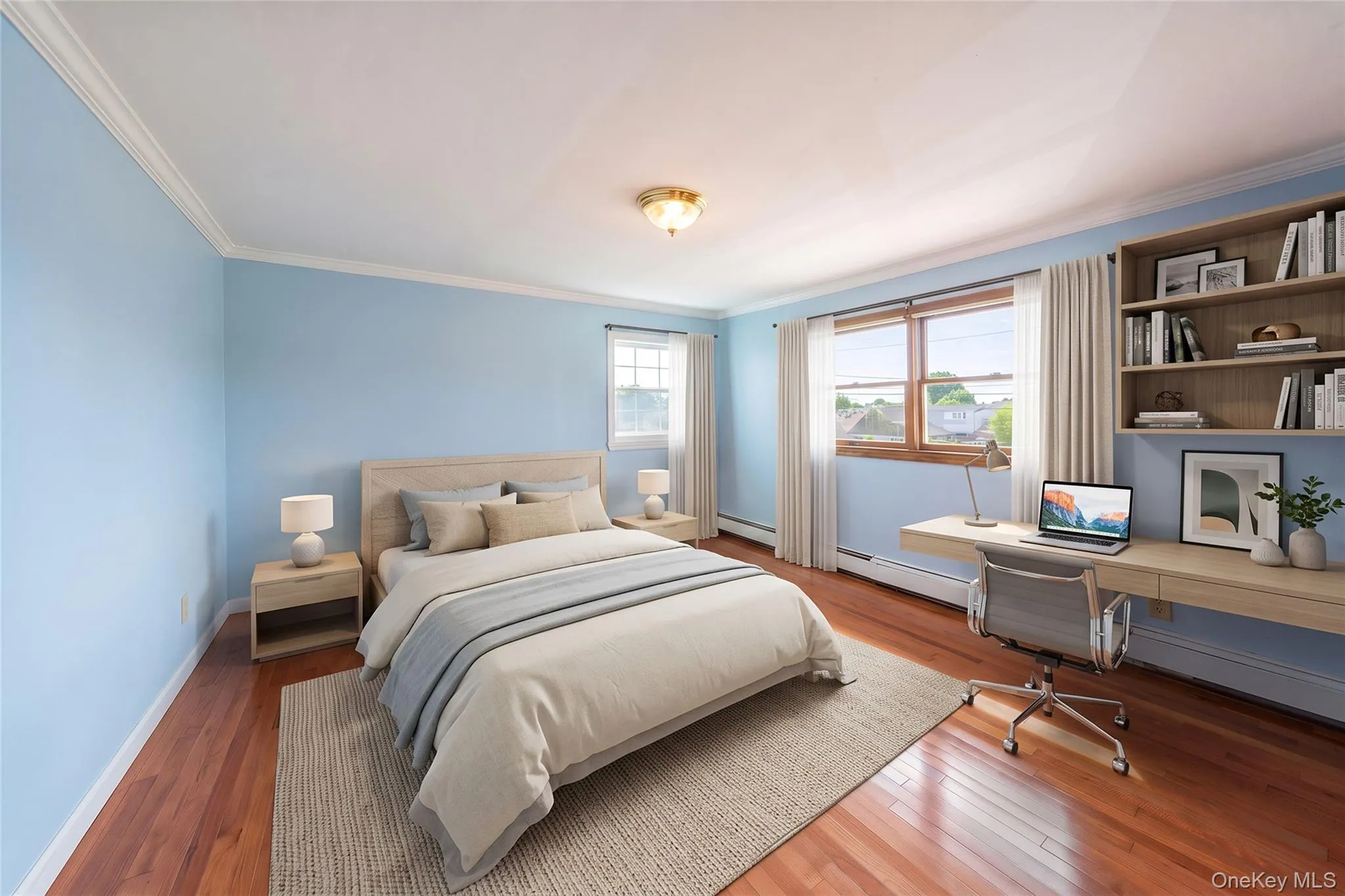 Wood-finish flooring, built-in shelving, two windows with natural light, and crown molding Wood-finish flooring, built-in shelving, two windows with natural light, and crown molding