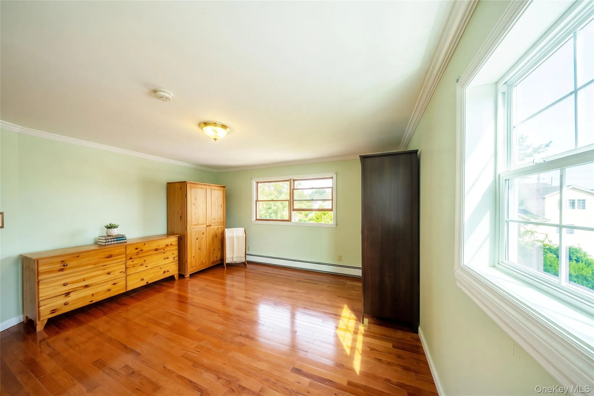 Hardwood flooring, crown molding, double-hung windows, and ceiling-mounted lighting Hardwood flooring, crown molding, double-hung windows, and ceiling-mounted lighting