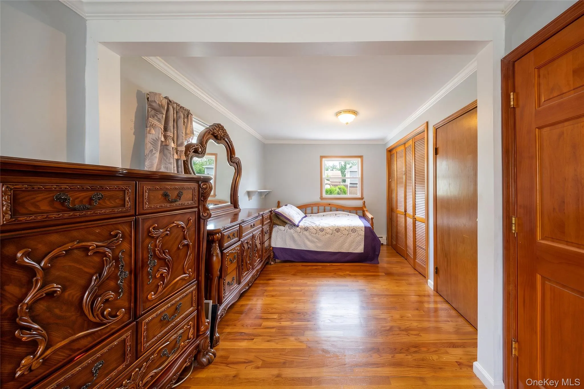 Hardwood flooring throughout, recessed window, and multiple built-in closets Hardwood flooring throughout, recessed window, and multiple built-in closets