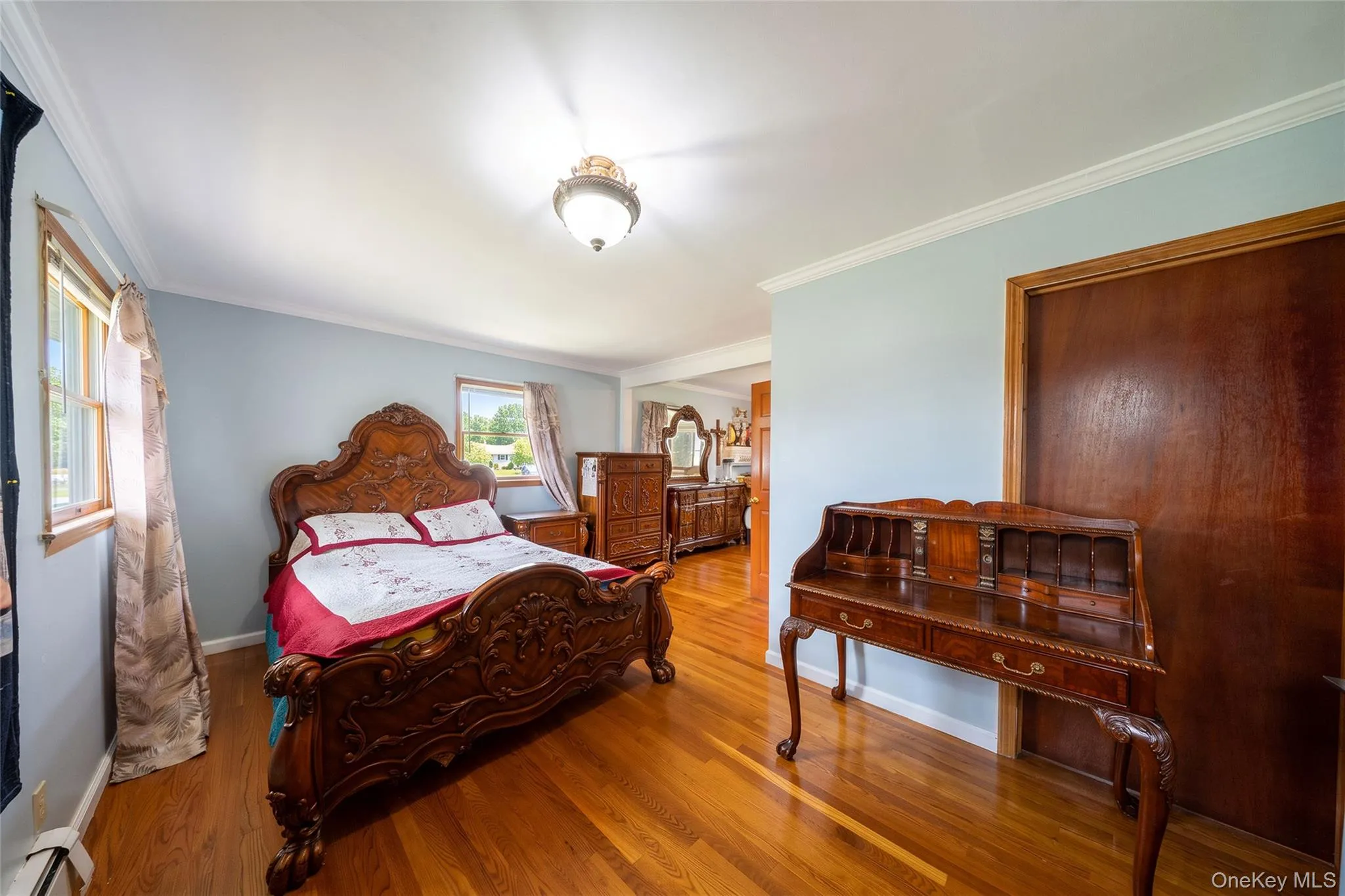 Hardwood flooring throughout, crown molding, and recessed lighting Hardwood flooring throughout, crown molding, and recessed lighting