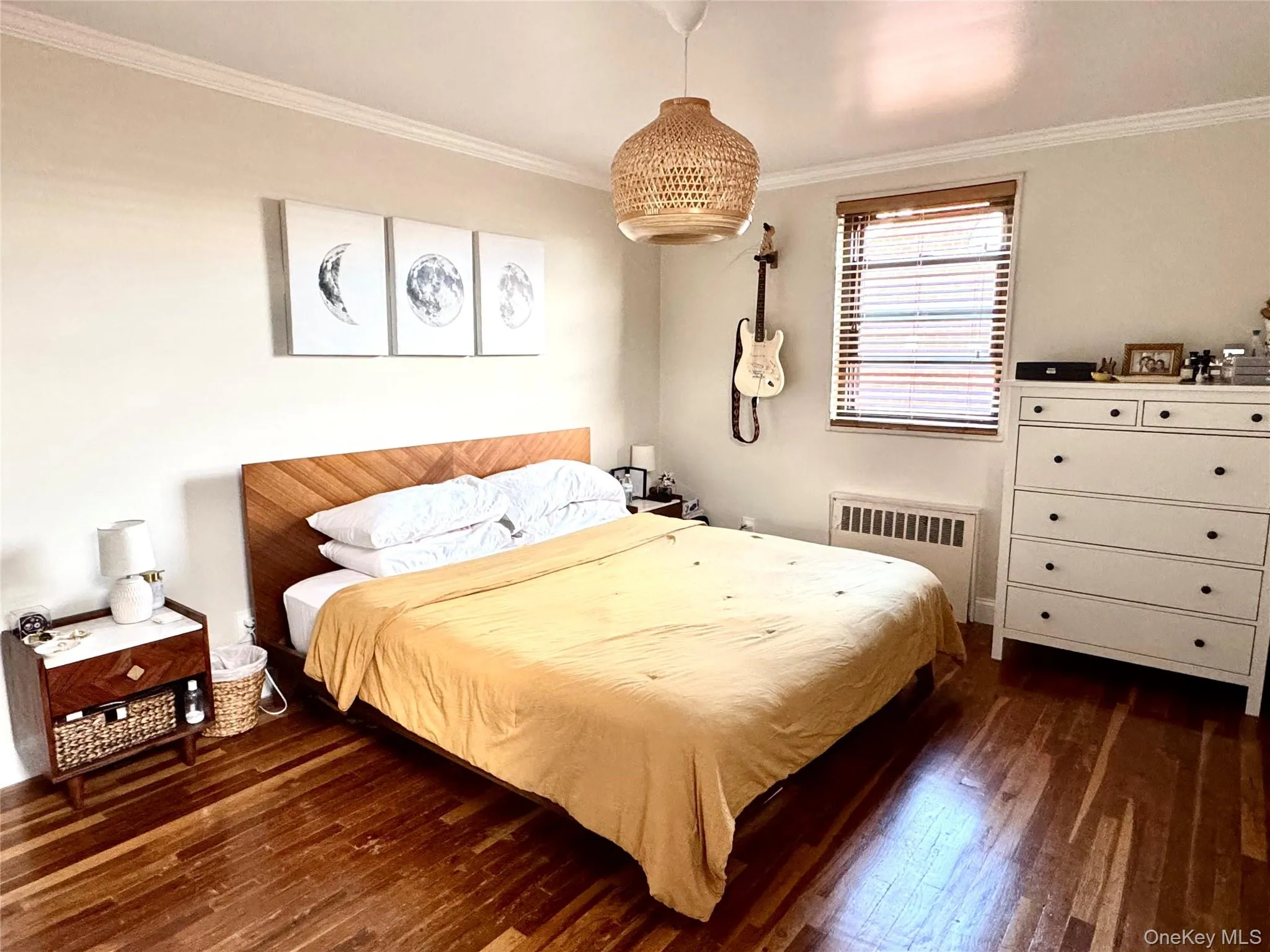Hardwood flooring, crown molding, and chandelier Hardwood flooring, crown molding, and chandelier